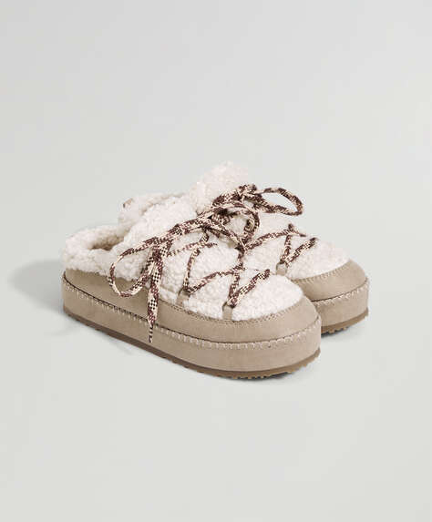 Laced furry slippers