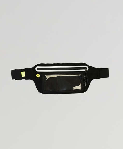 Belt bag for running. Touch-screen. Earphone port and transparent pocket. Adjustable strap. Measurements: 21 x 12cm