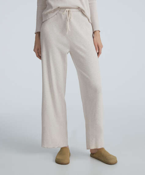 Pantalon avec taille réglable par élastique et lien avec imprimé à rayures.