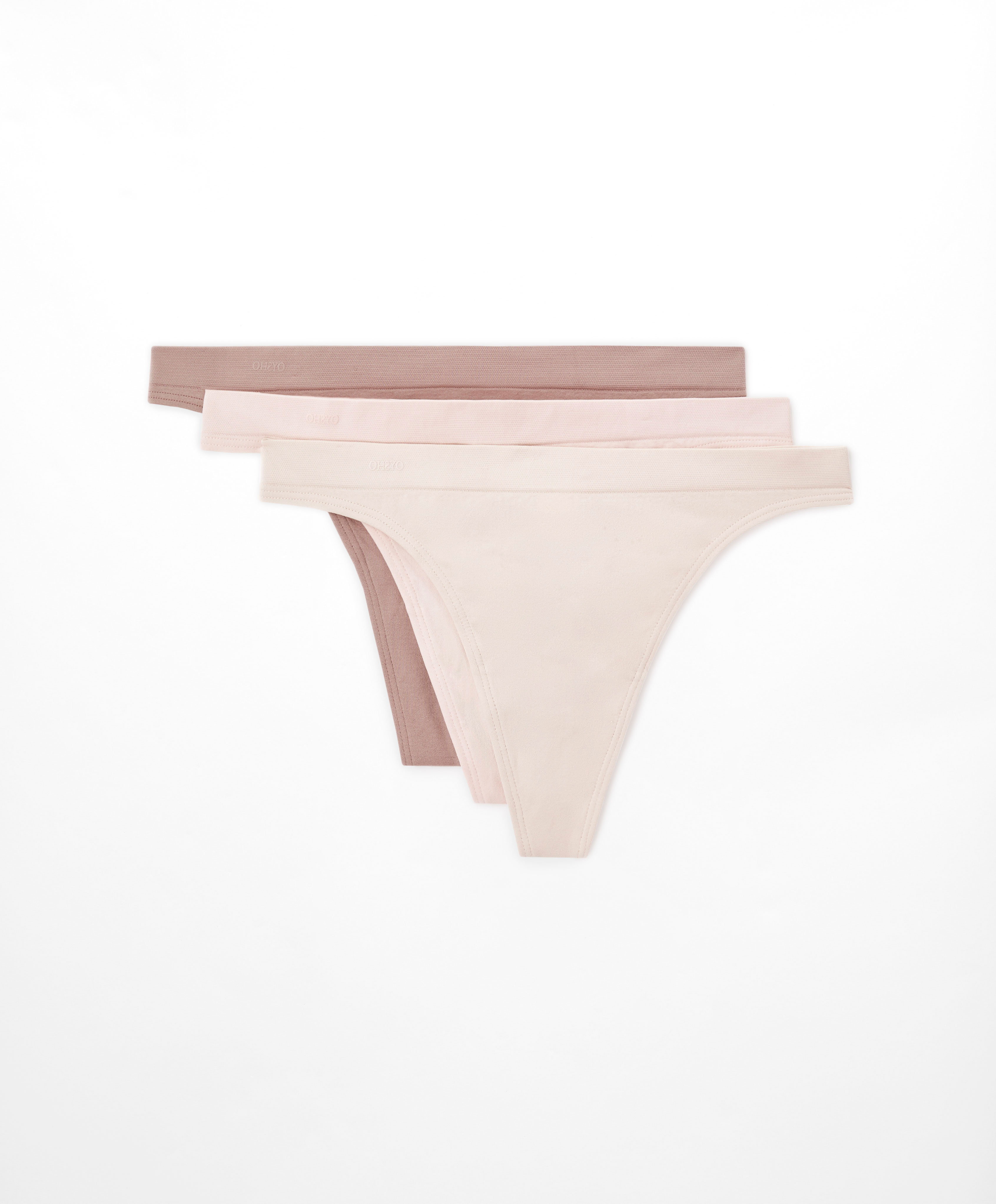 Pack of three thongs in seamless soft-touch fabric. Stretch waist. 100% recycled paper packaging.