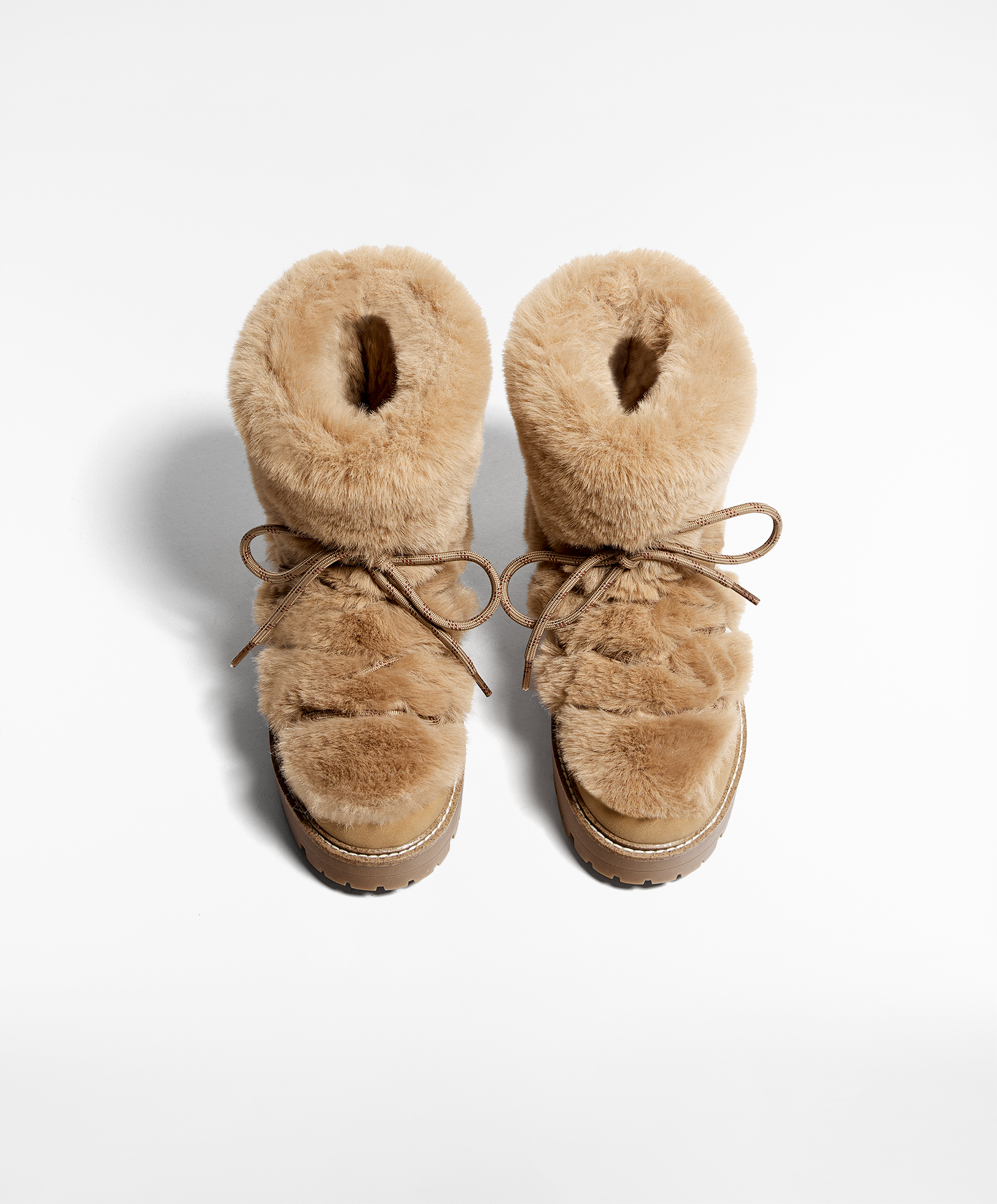 Lace up faux fur boots