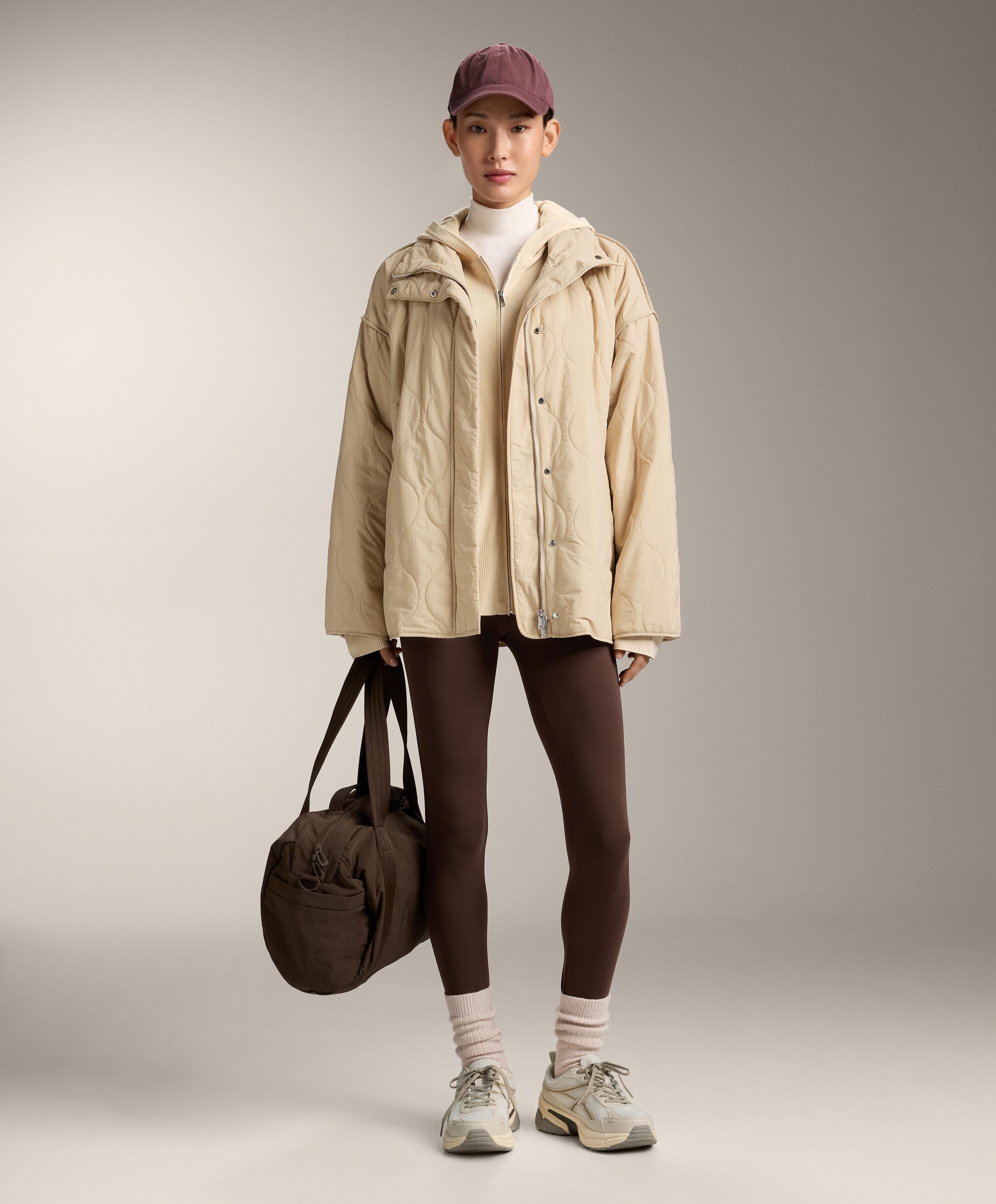 Veste longue en maille à capuche