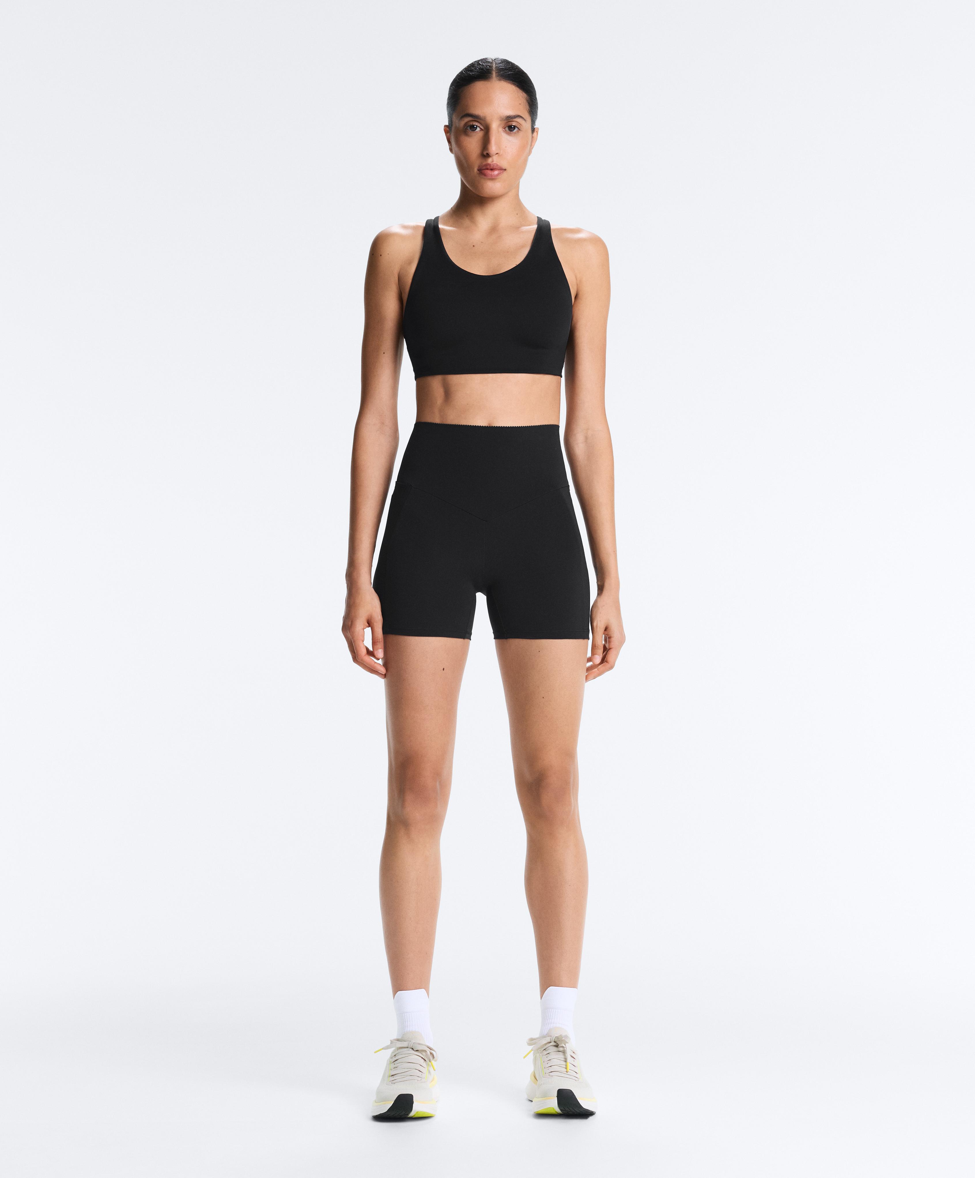 Black compressive hot pant pocket total look