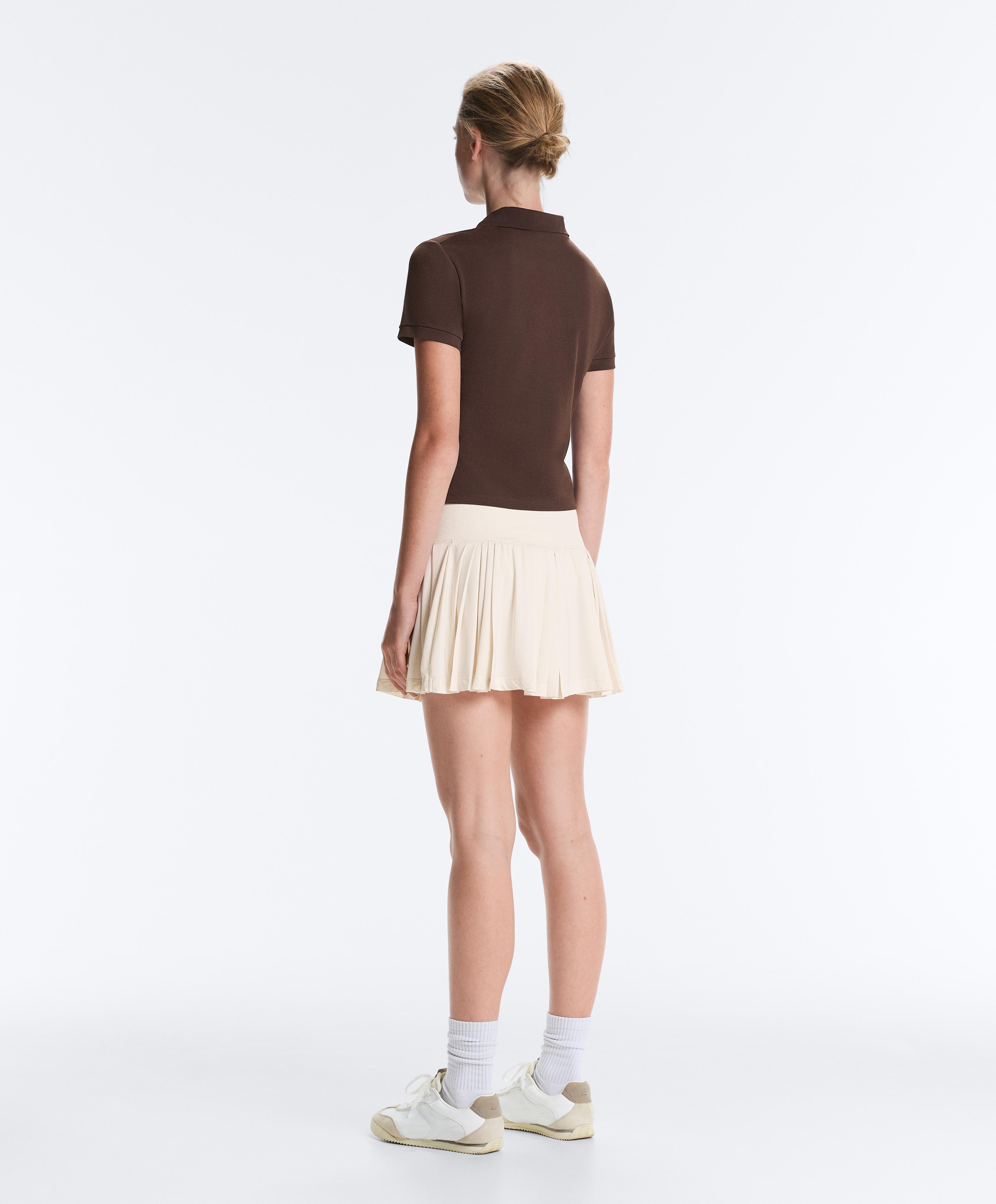 Pleated high-rise seamless short skirt — PALE ECRU