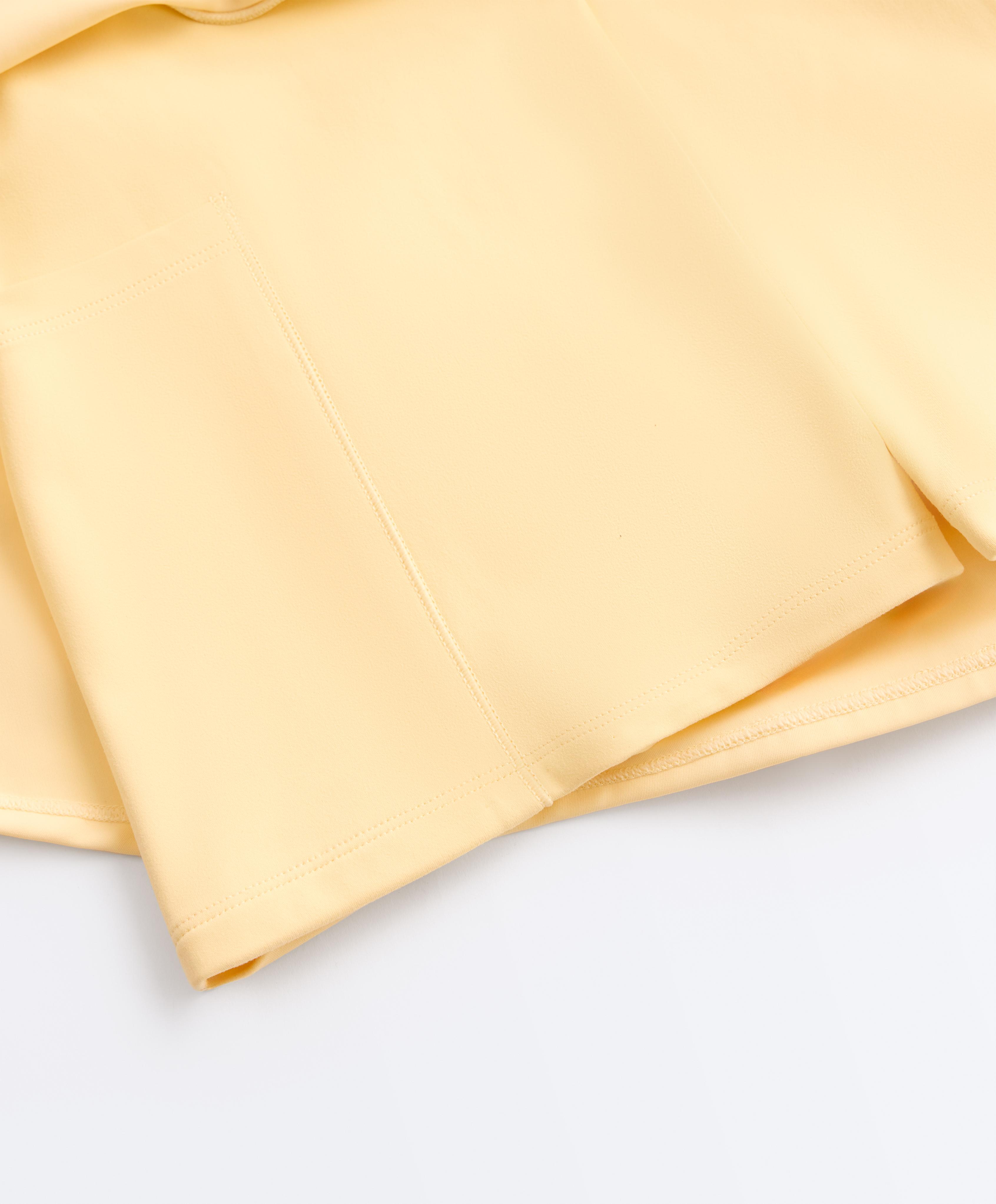 Double layer high rise short skirt — PALE YELLOW