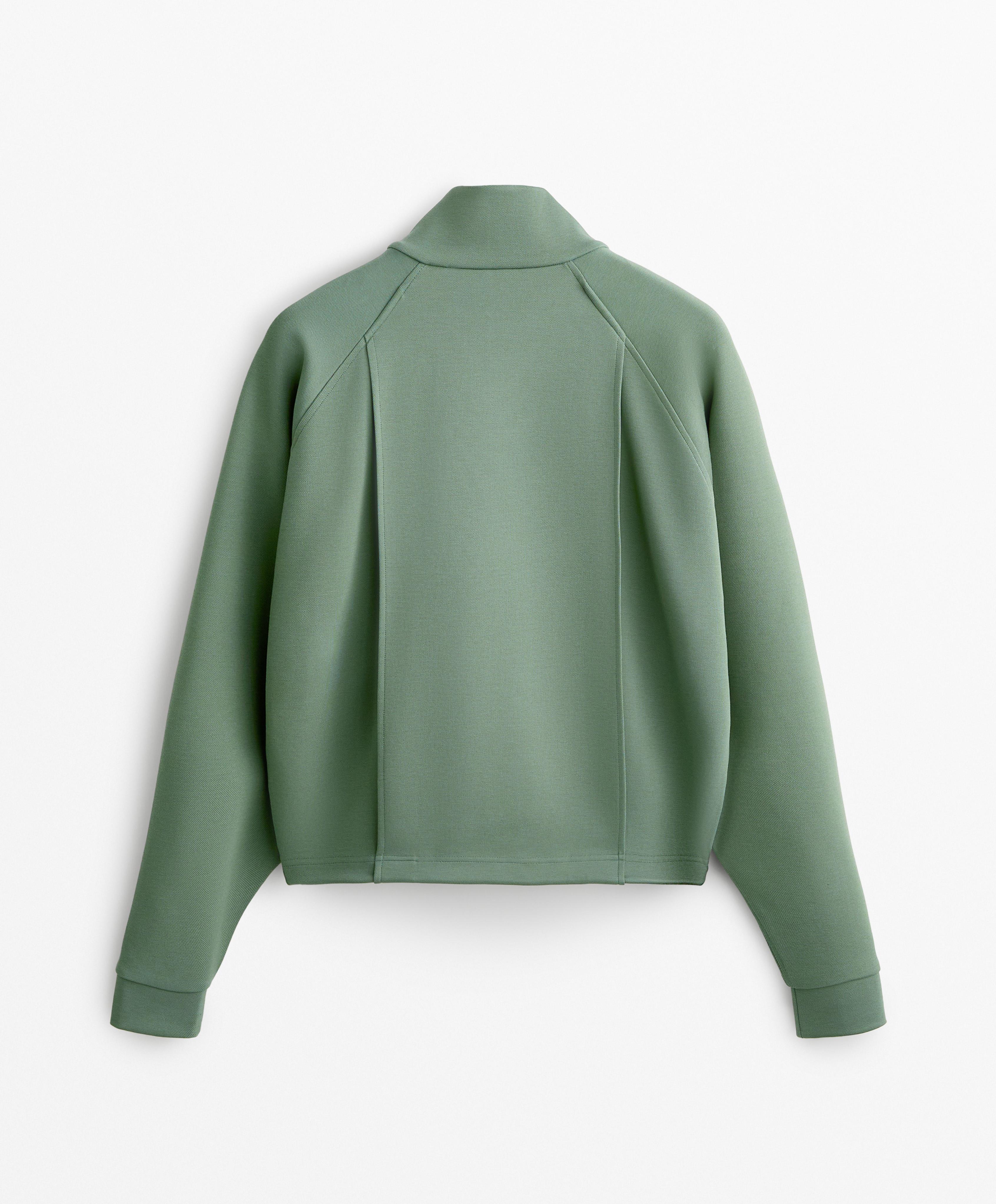 Veste en piqué à poches contenant du coton