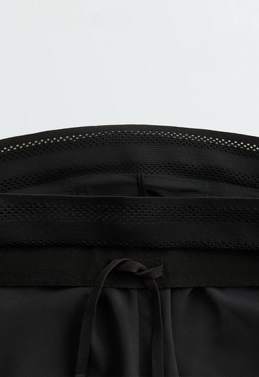 Technical mid rise 2-in-1 shorts — BLACK 9