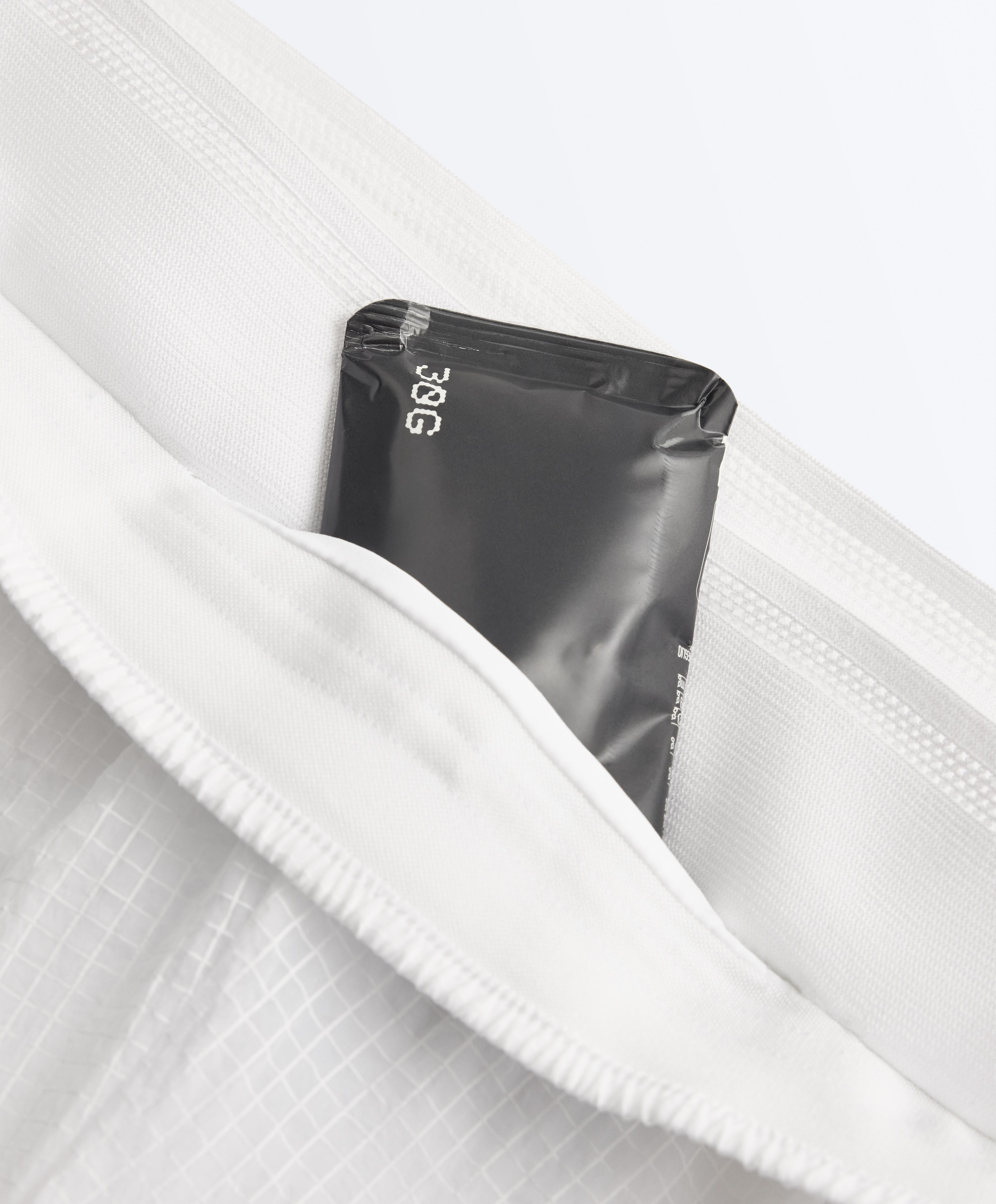 Technical 2-in-1 checked mid-rise shorts — WHITE