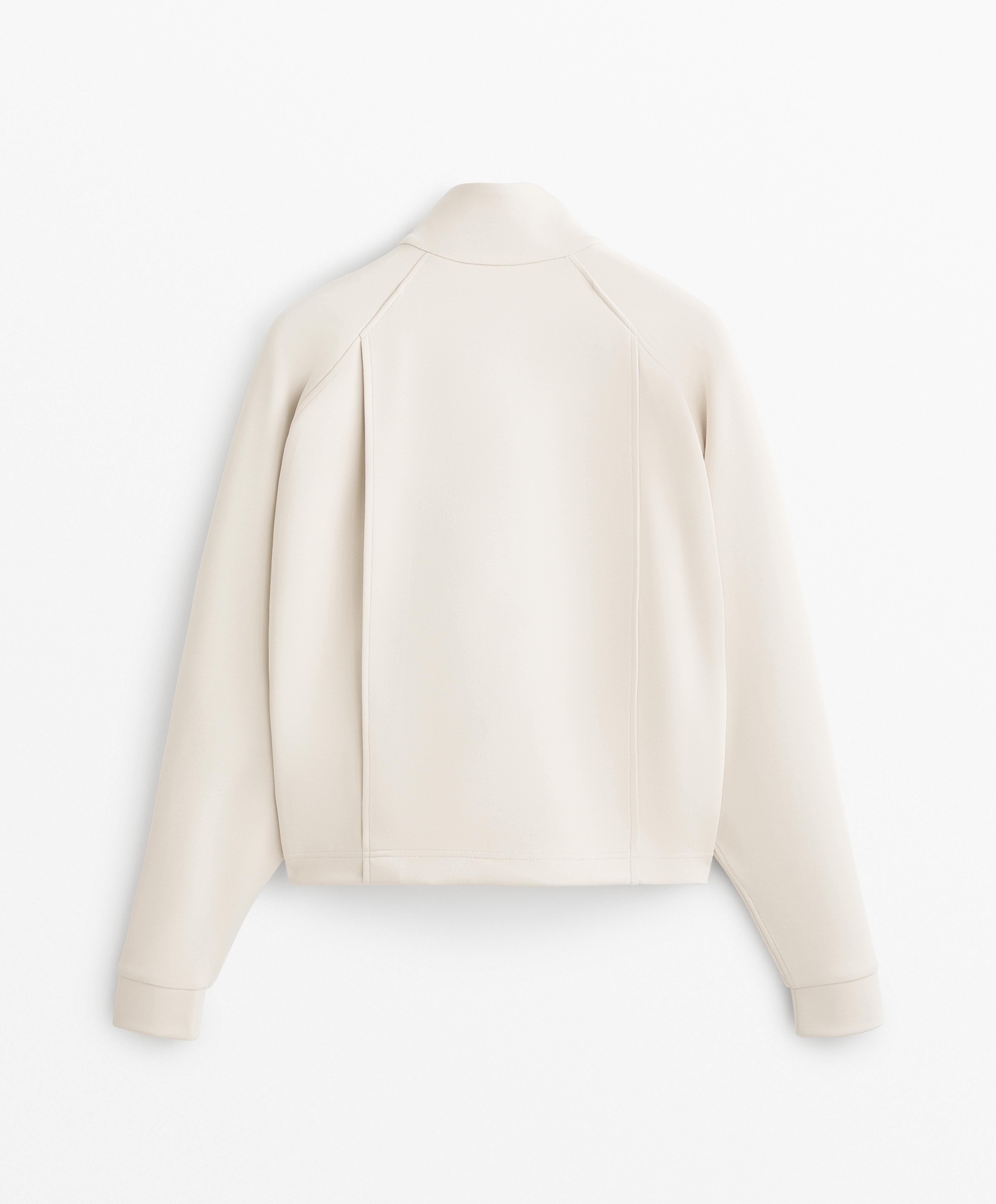 Veste en piqué à poches contenant du coton