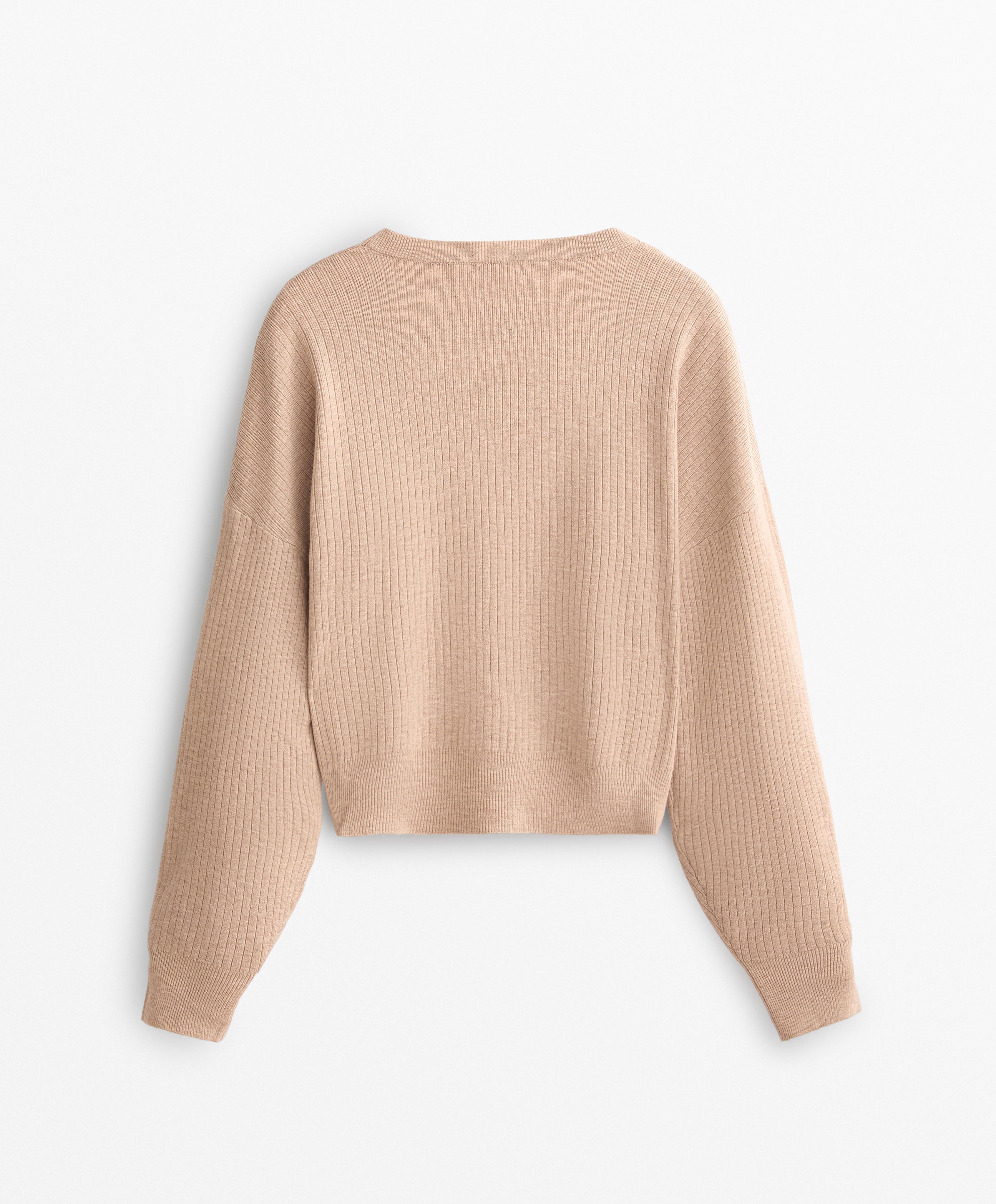 Knit crop jumper with crossover design