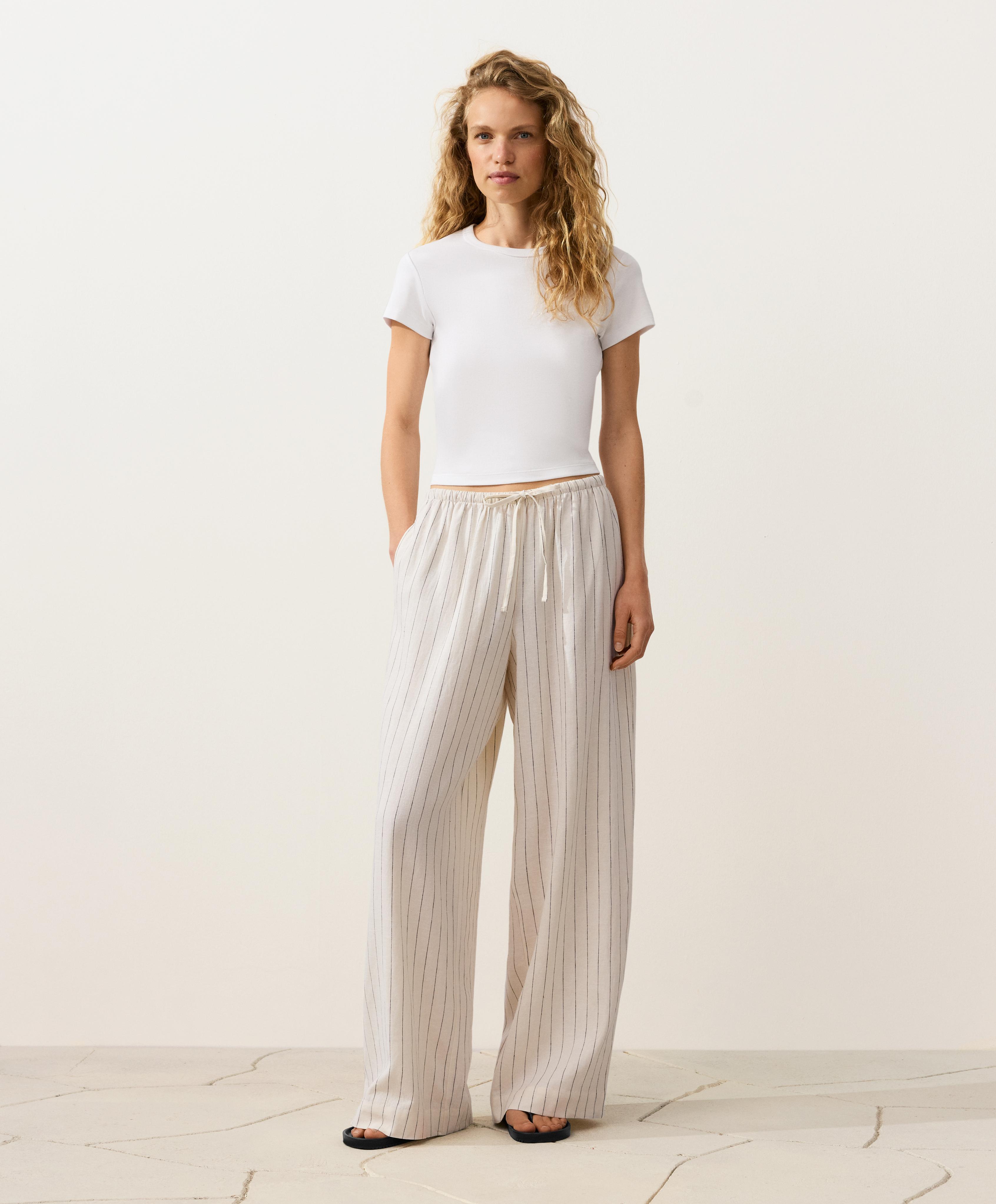 Pantalón recto detalle costura 100% lino Pantalón recto detalle costura 100% lino