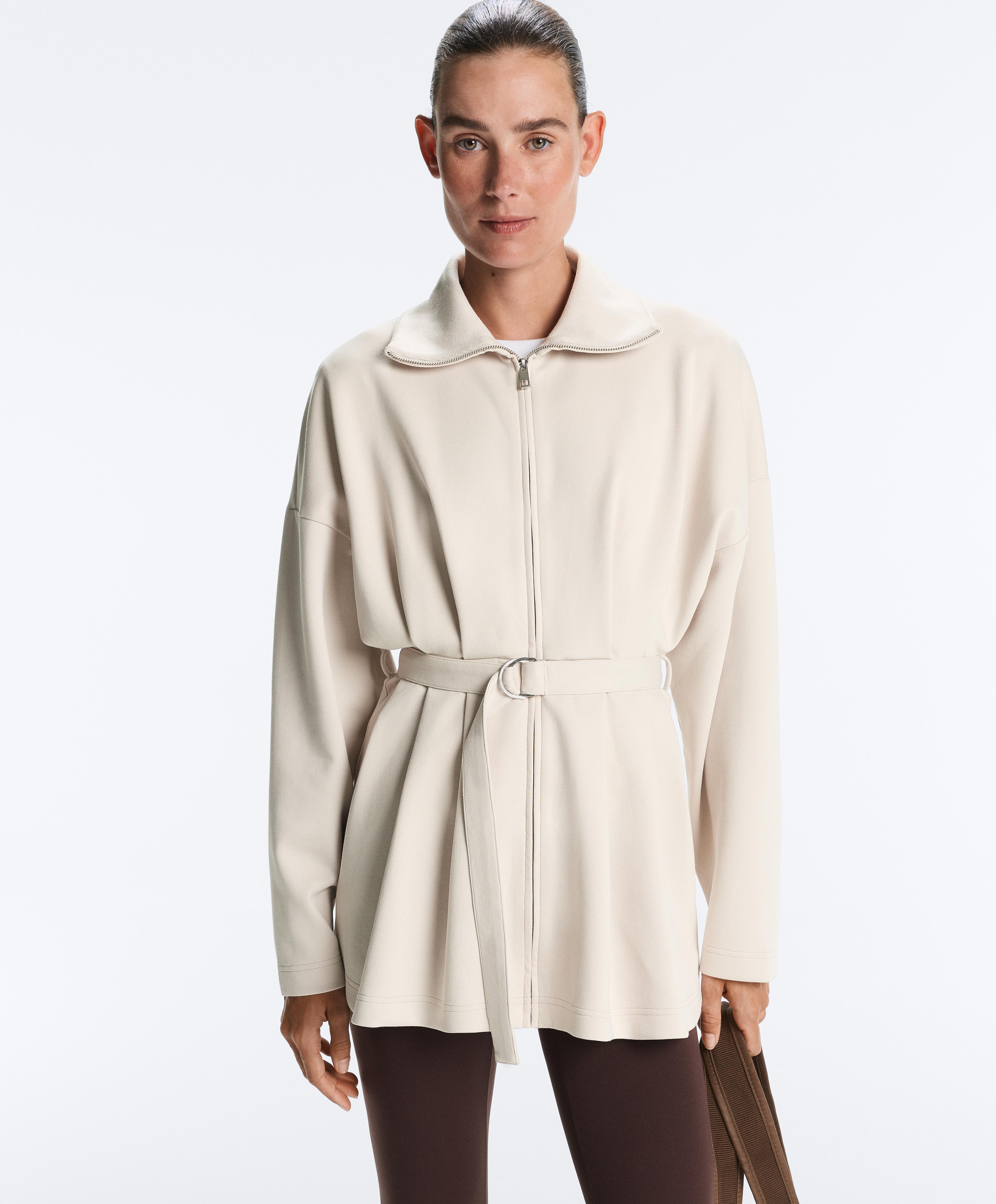 Long piqué jacket with belt and pleat detail Long piqué jacket with belt and pleat detail