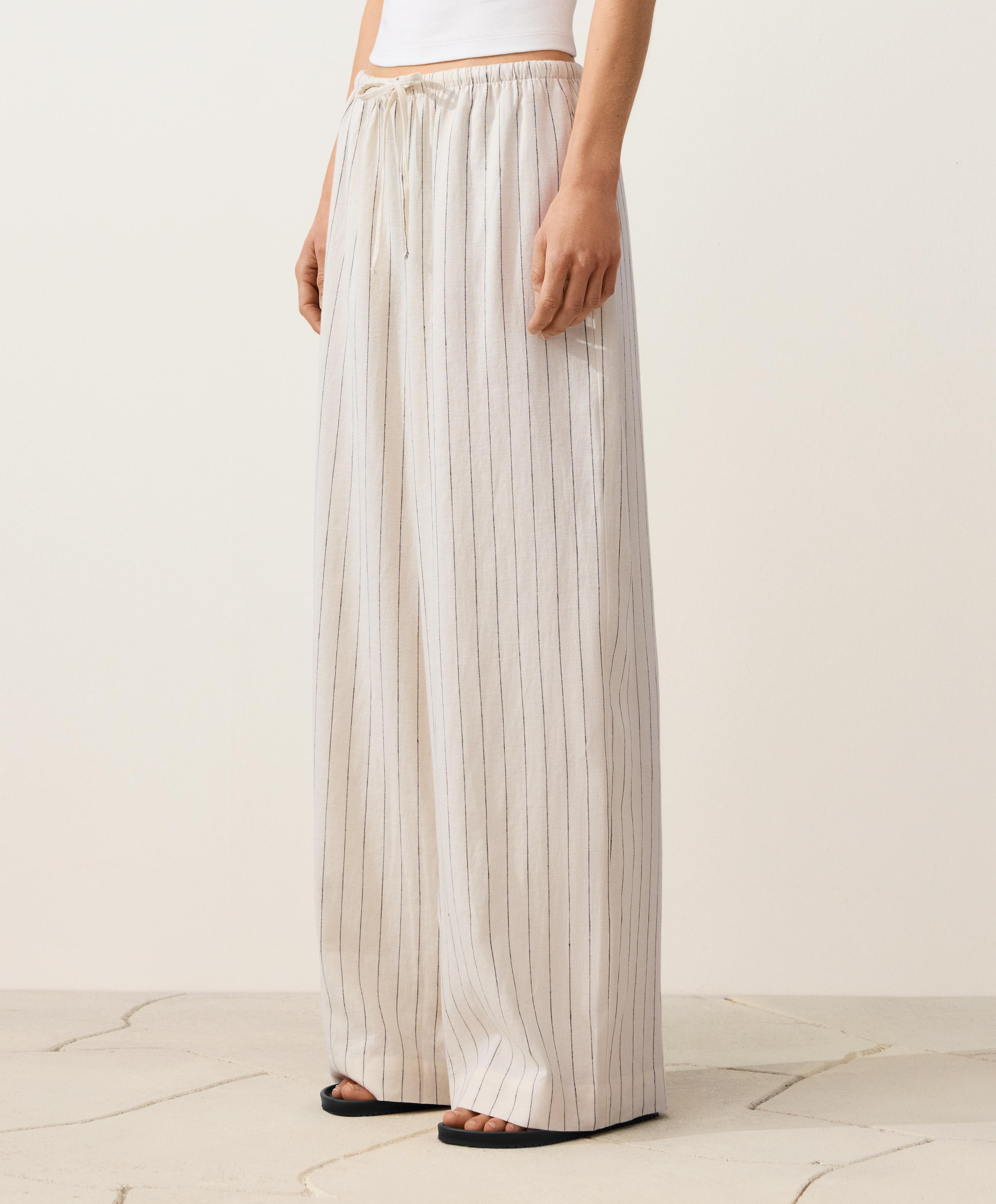 Pantalón recto detalle costura 100% lino Pantalón recto detalle costura 100% lino