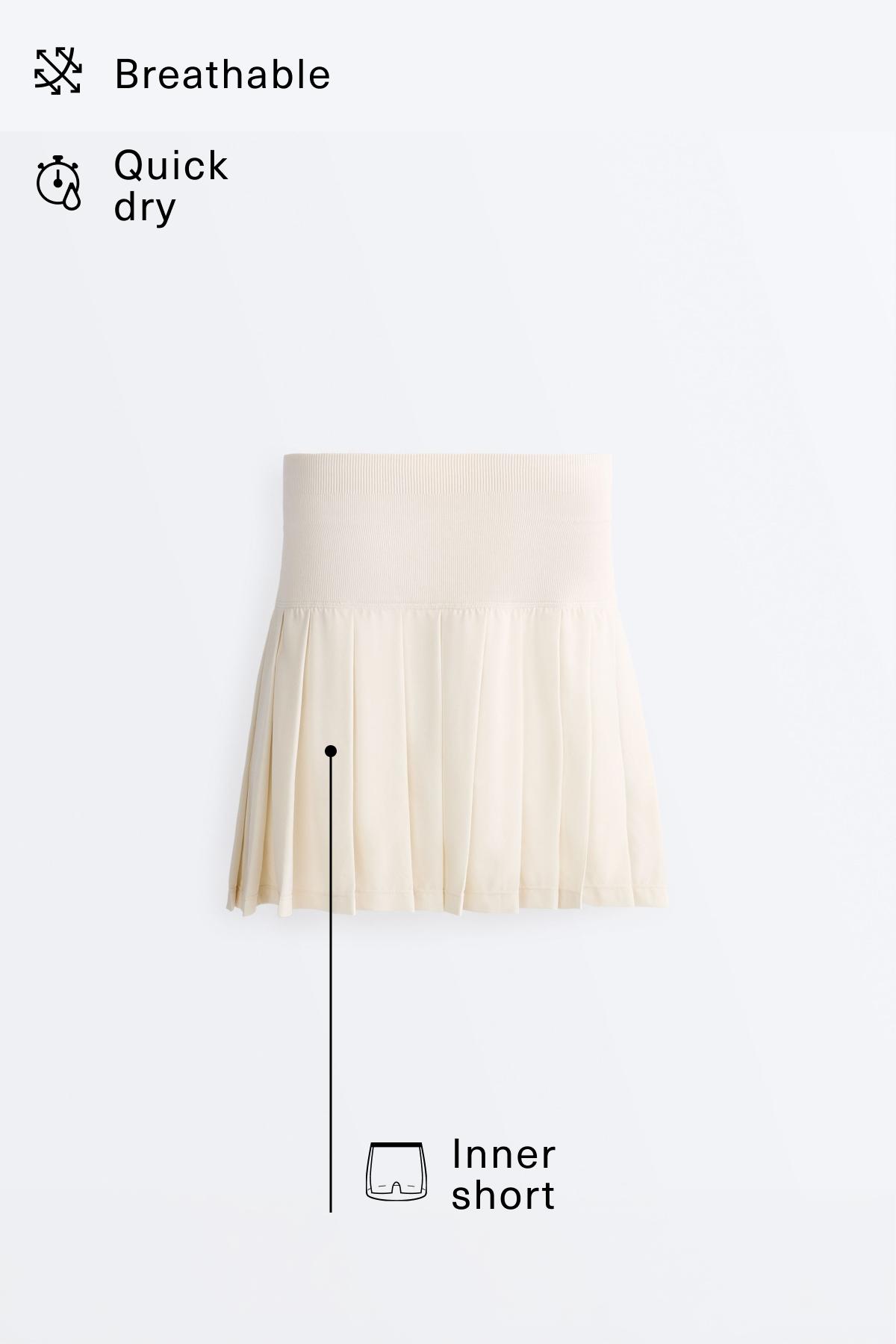 Pleated high-rise seamless short skirt — PALE ECRU