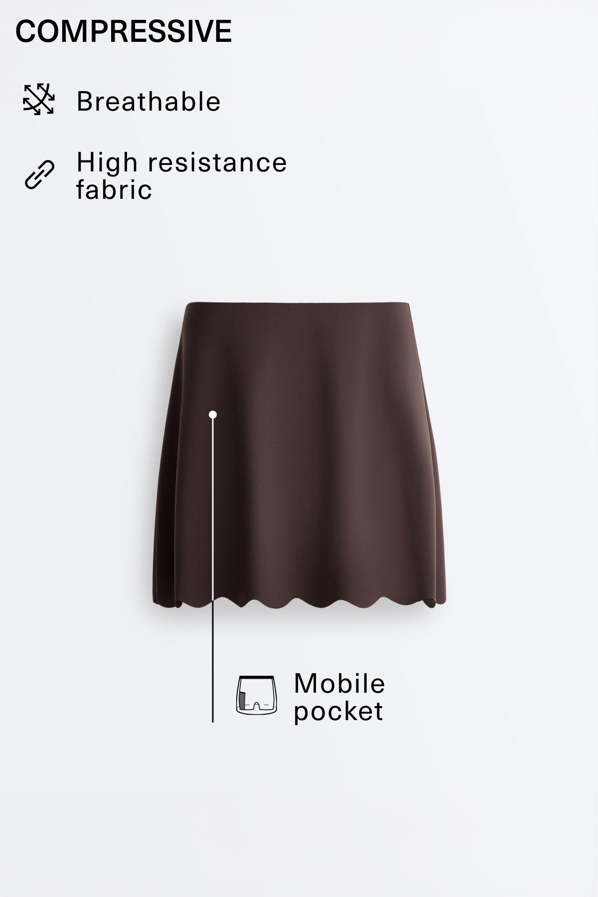 Compressive high-rise wavy short skirt — DARK REDDISH‑BROWN
