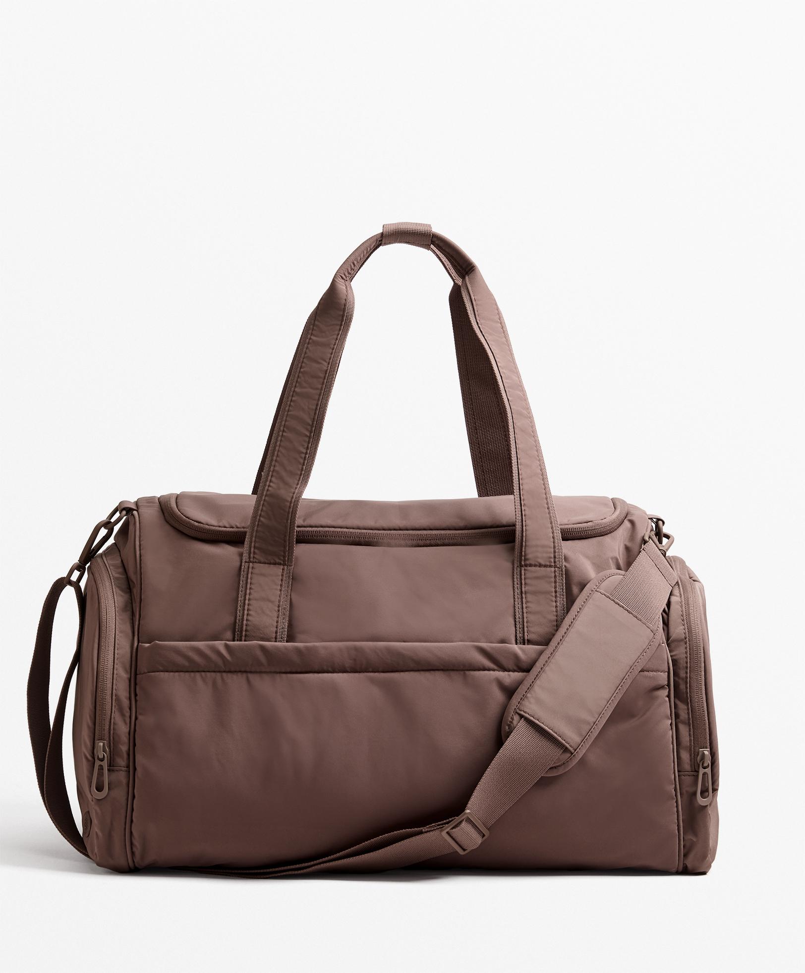 Technical bag with side pockets