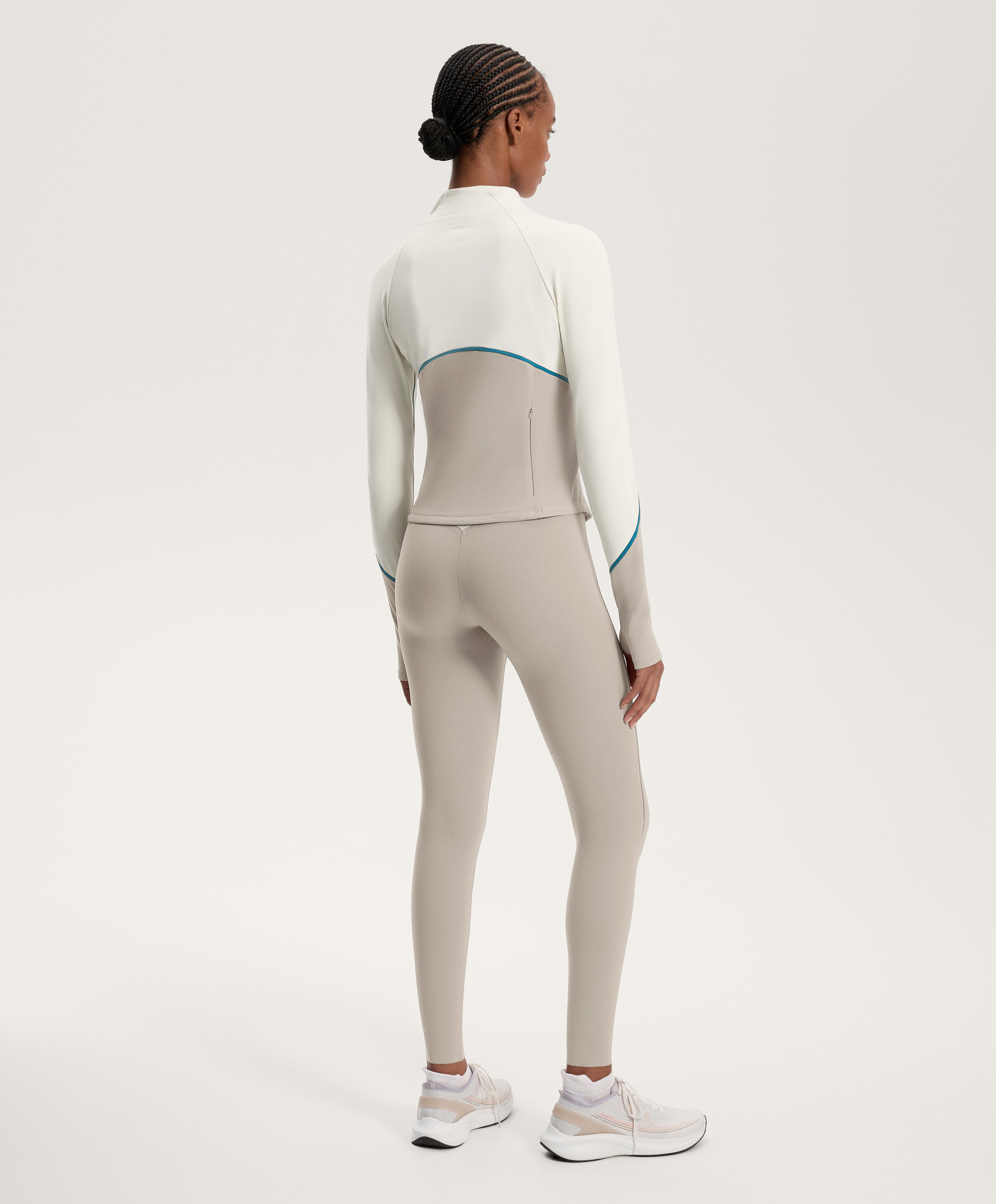 Total look running light warm écru chiaro con compressive core a righe - Saldi