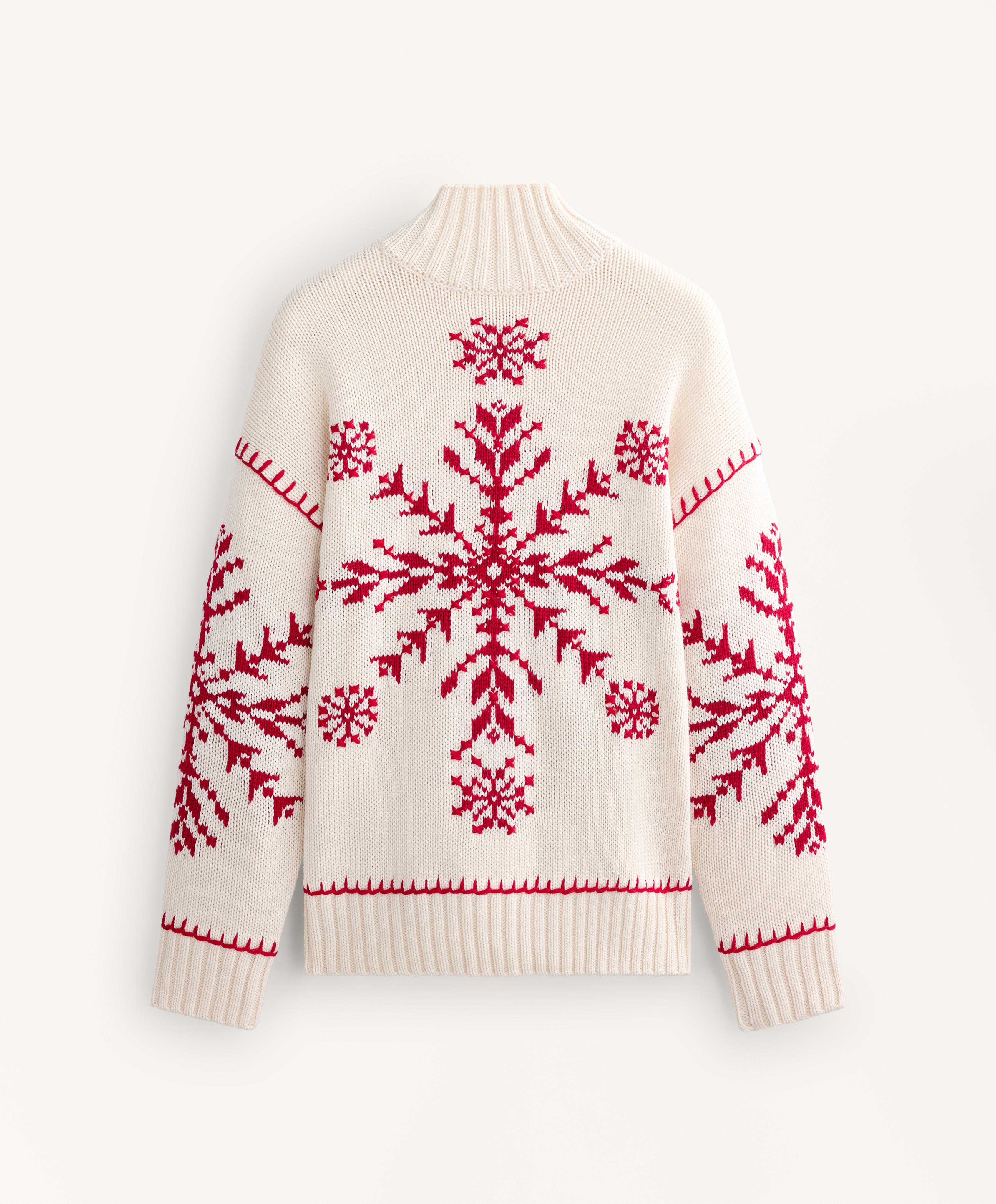 Gebreide trui met sneeuwvlokborduursel