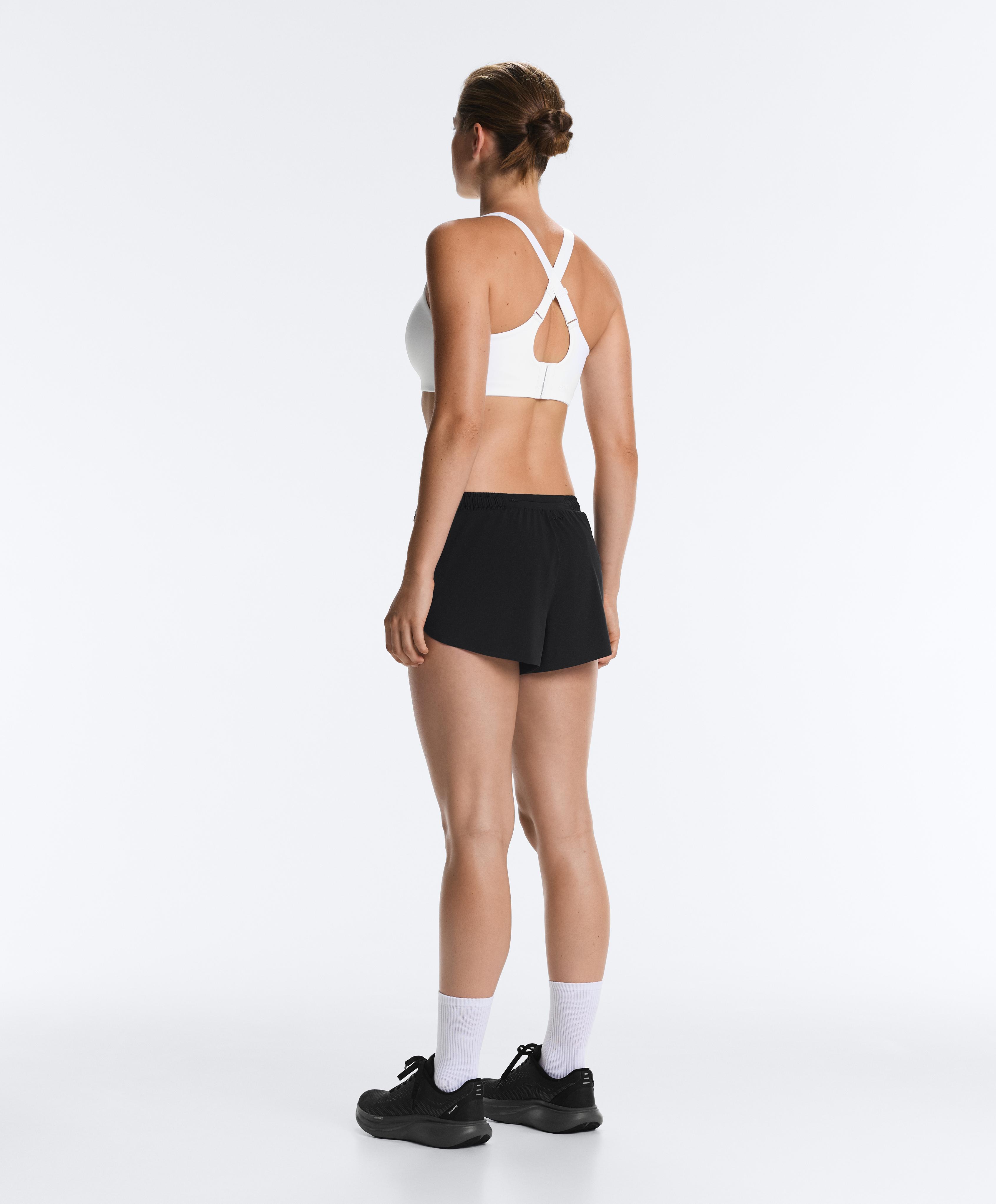 High-support Compressive sports bra with crossover back — WHITE