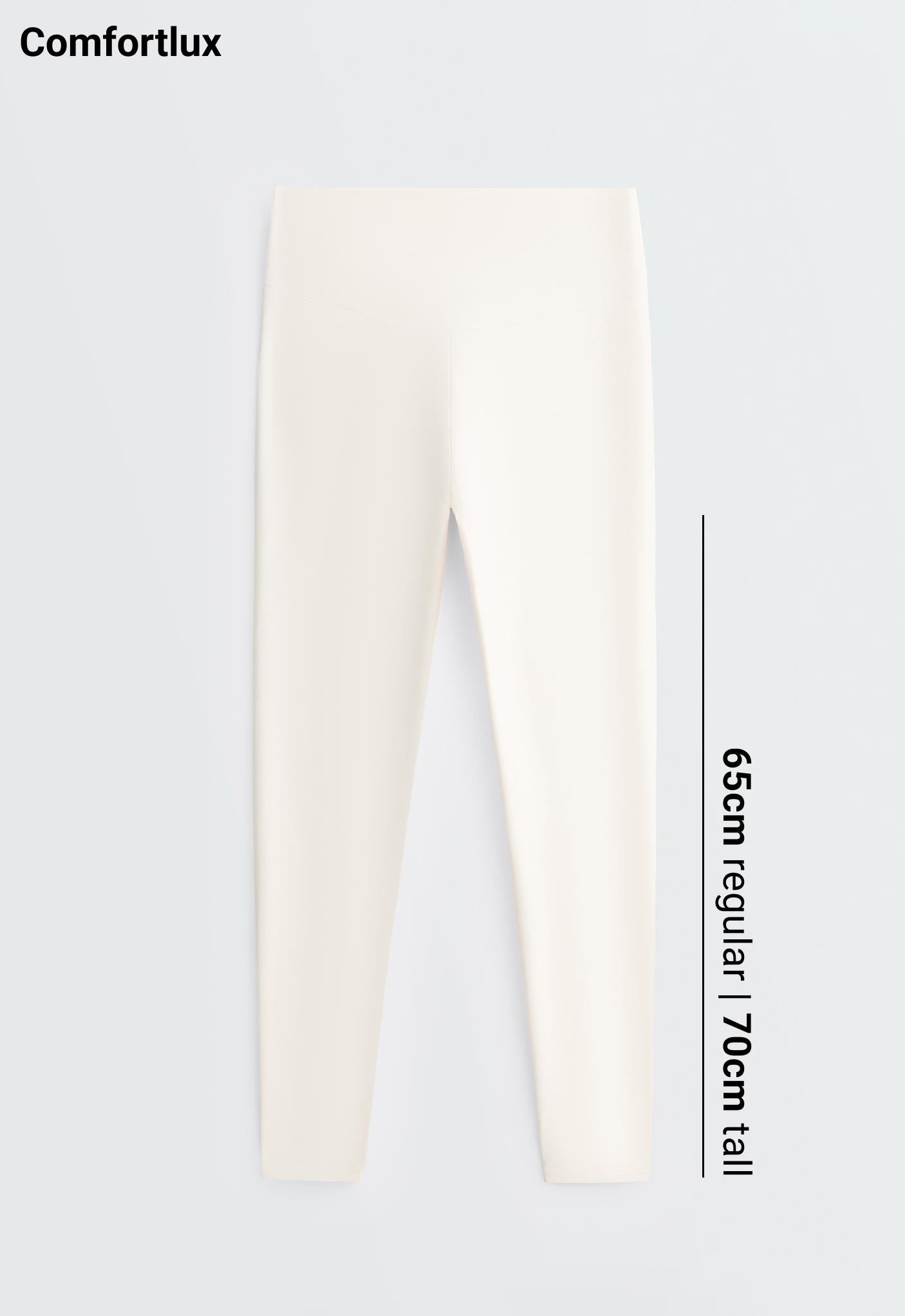 Front view of solid cream-colored, high-waisted, fitted leggings.