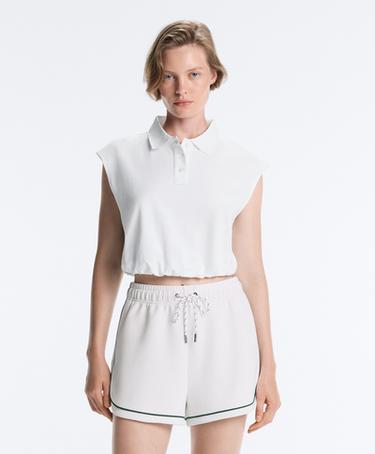 Sleeveless piqué cotton polo shirt — WHITE  1