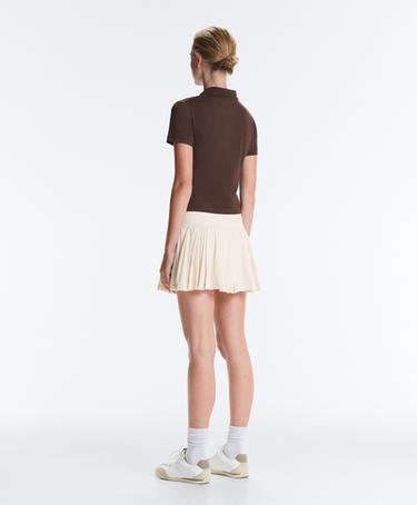 Pleated high-rise seamless short skirt — PALE ECRU 9