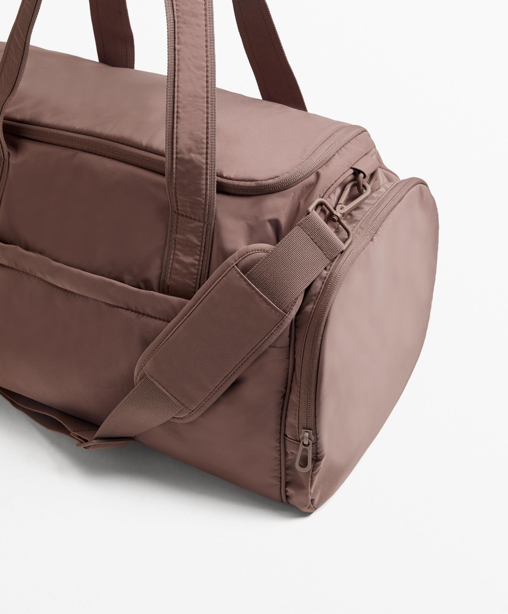 Technical bag with side pockets