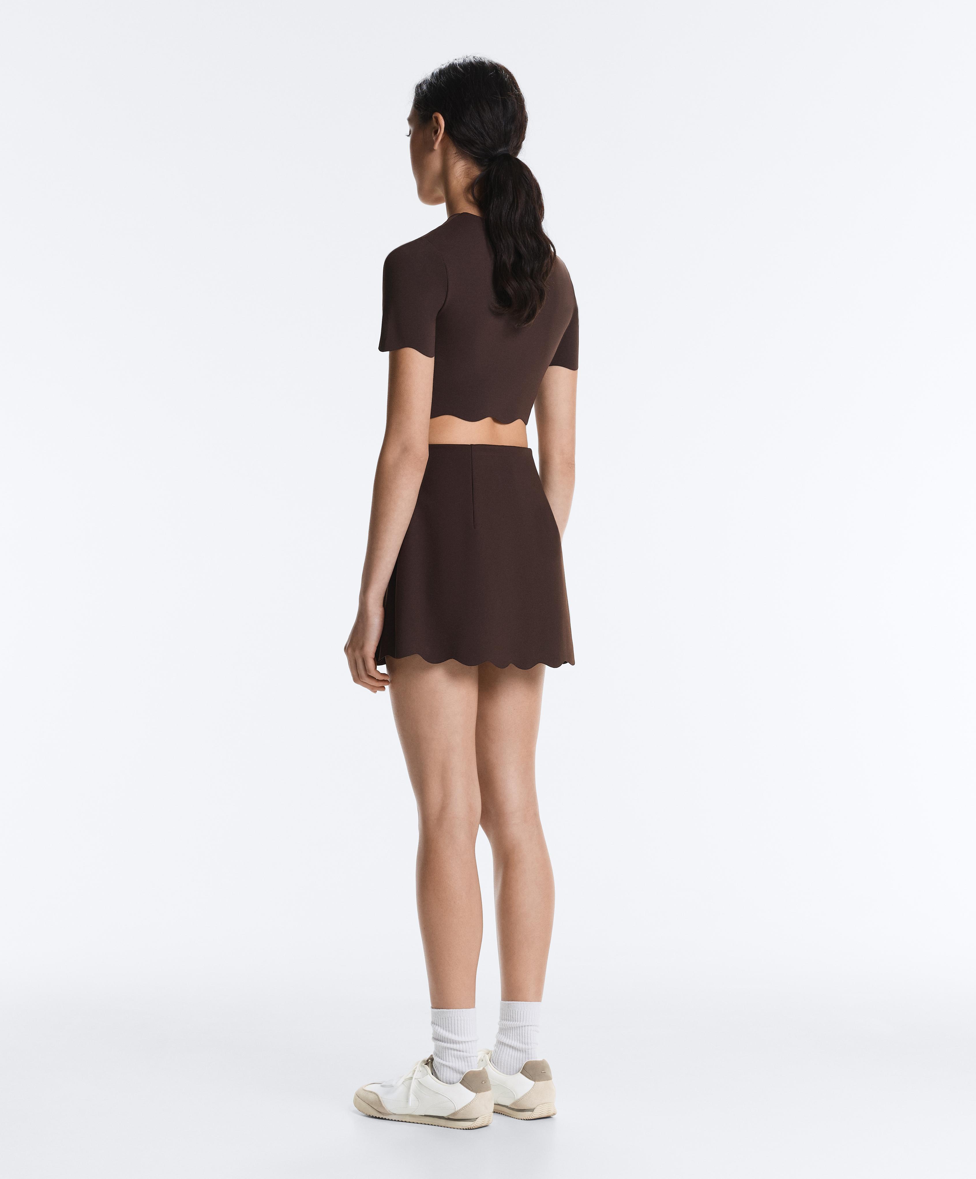 Compressive high-rise wavy short skirt — DARK REDDISH‑BROWN