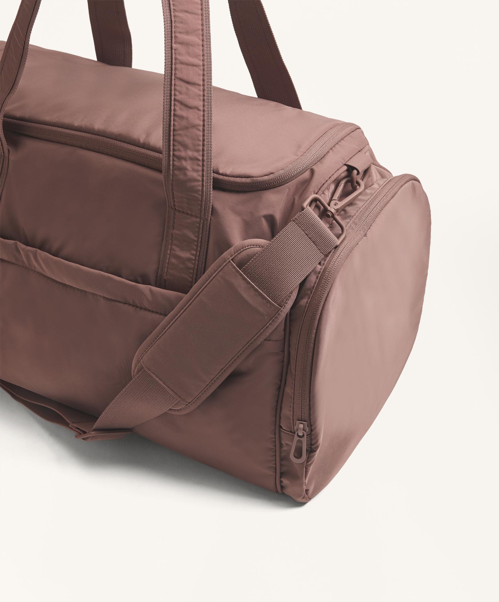 Technical bag with side pockets
