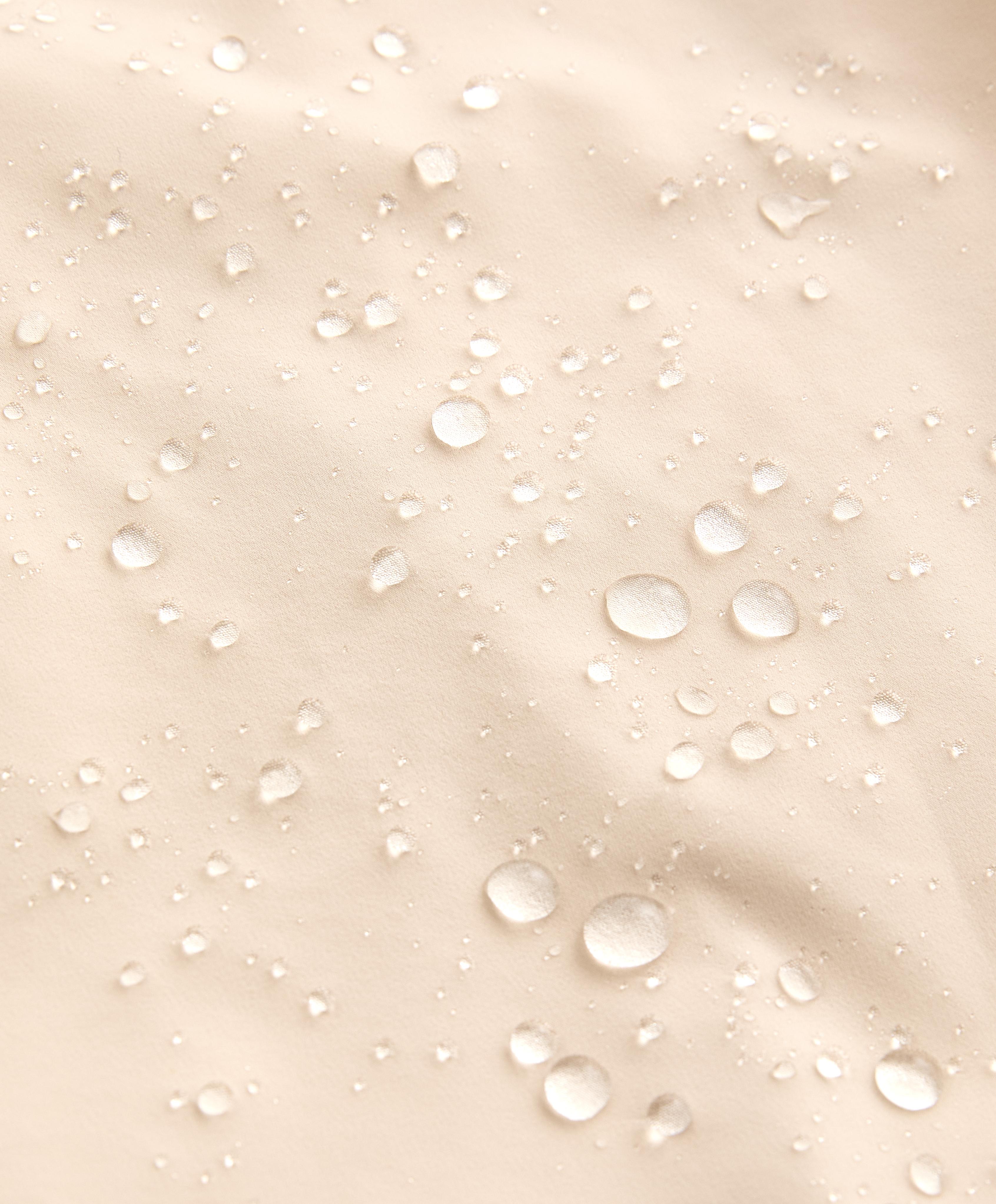 Long extra lightweight 10k waterproof jacket — PALE BEIGE