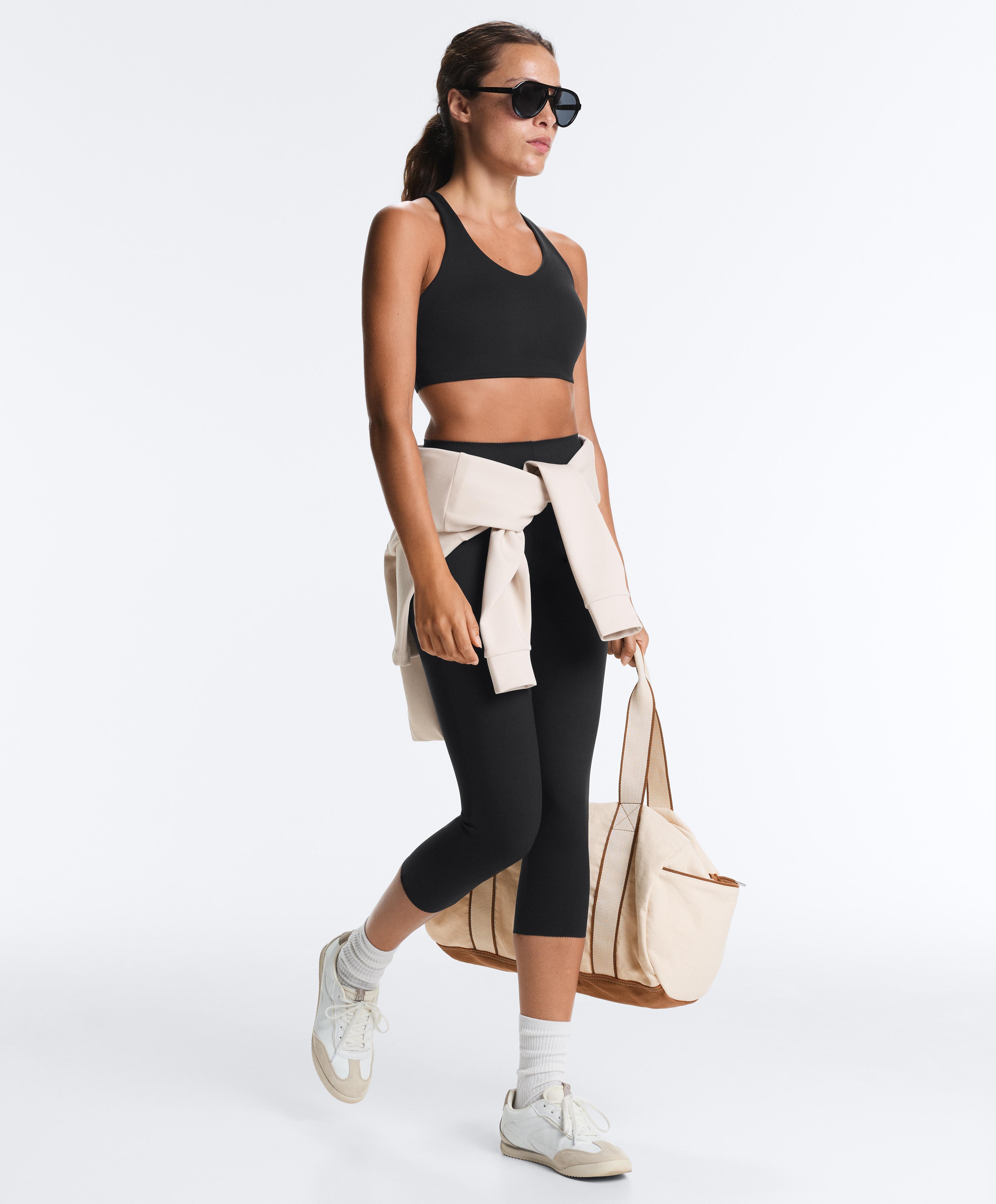 High-support Compressive sports bra with crossover back — BLACK