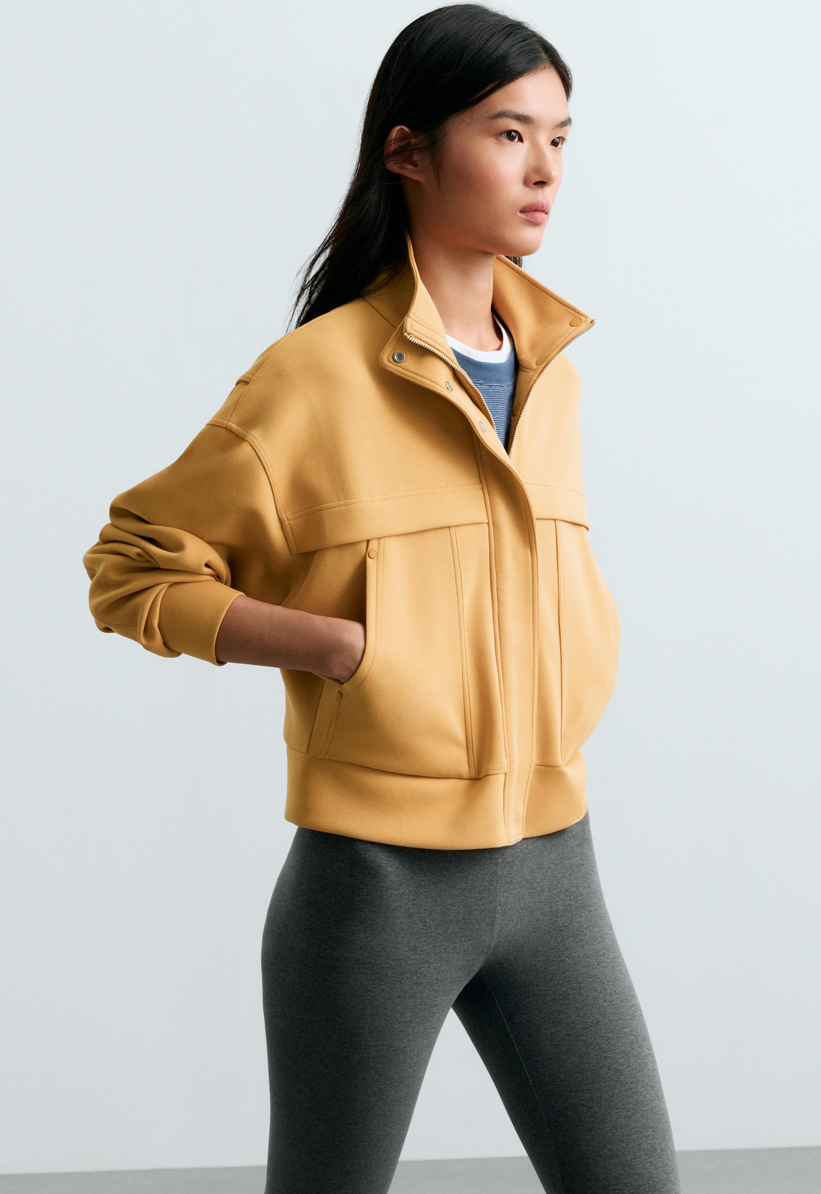 Chaqueta bomber bolsillos con algodón piqué