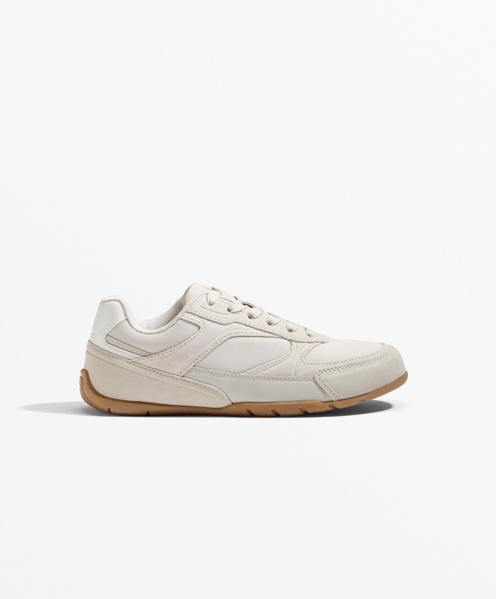 Sneakers van stof met suède inzetstukken