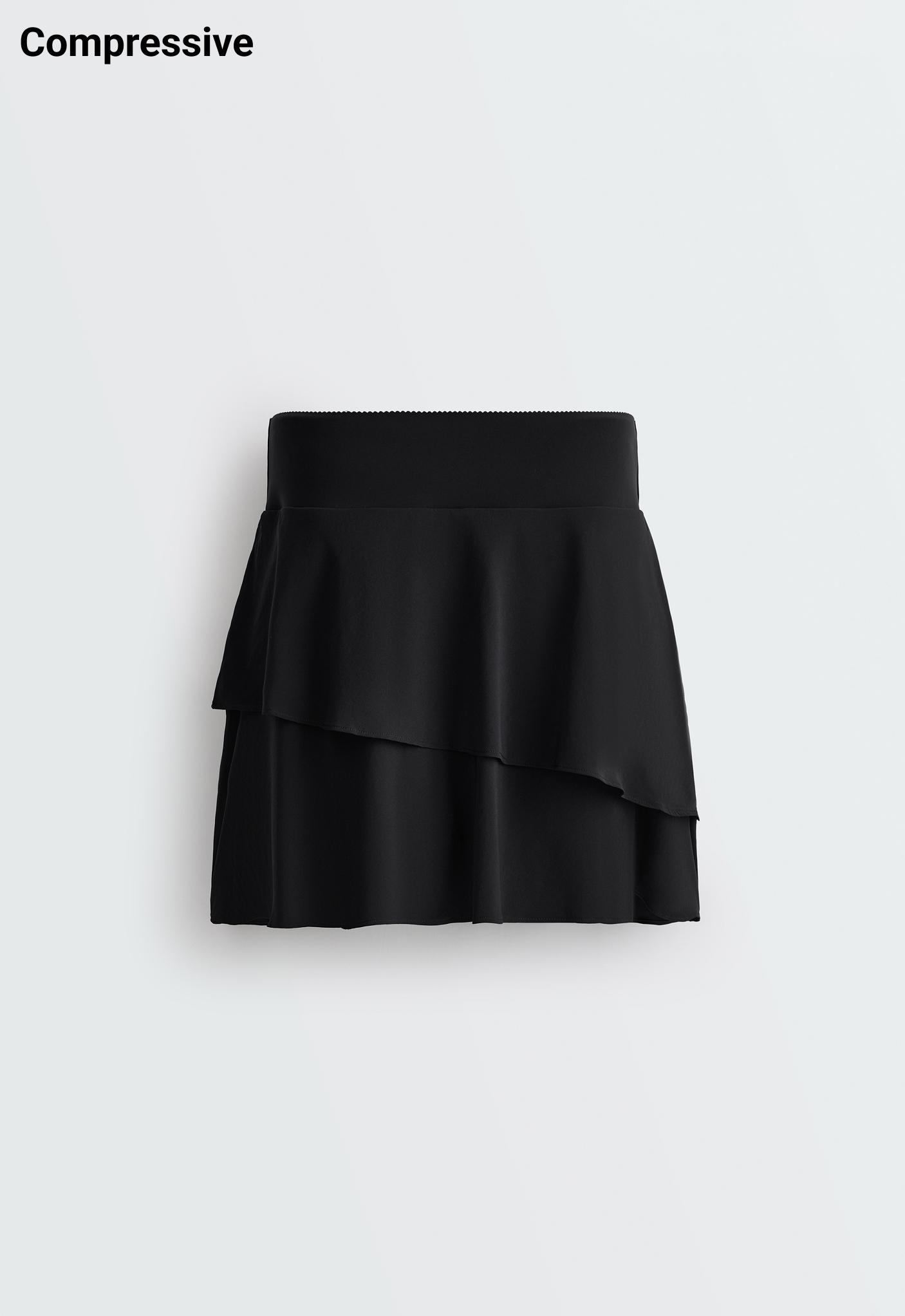 High-rise Compressive frill short skirt — BLACK