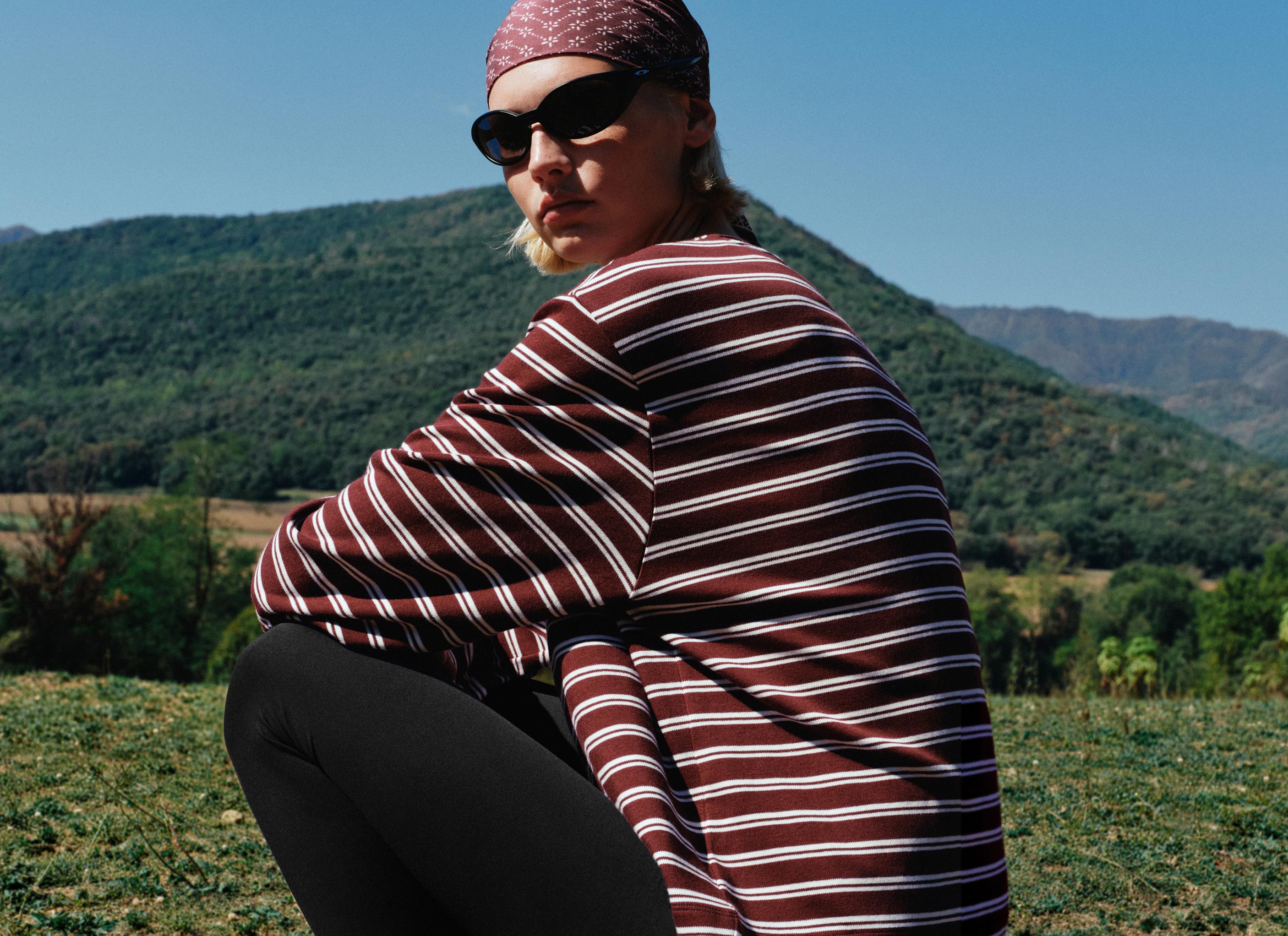 Burgundy loose-fitting long-sleeve shirt with white horizontal stripes and black pants set.