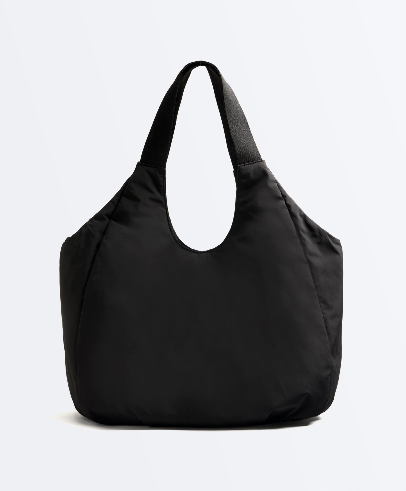 Shopper bag with contrasting handle
