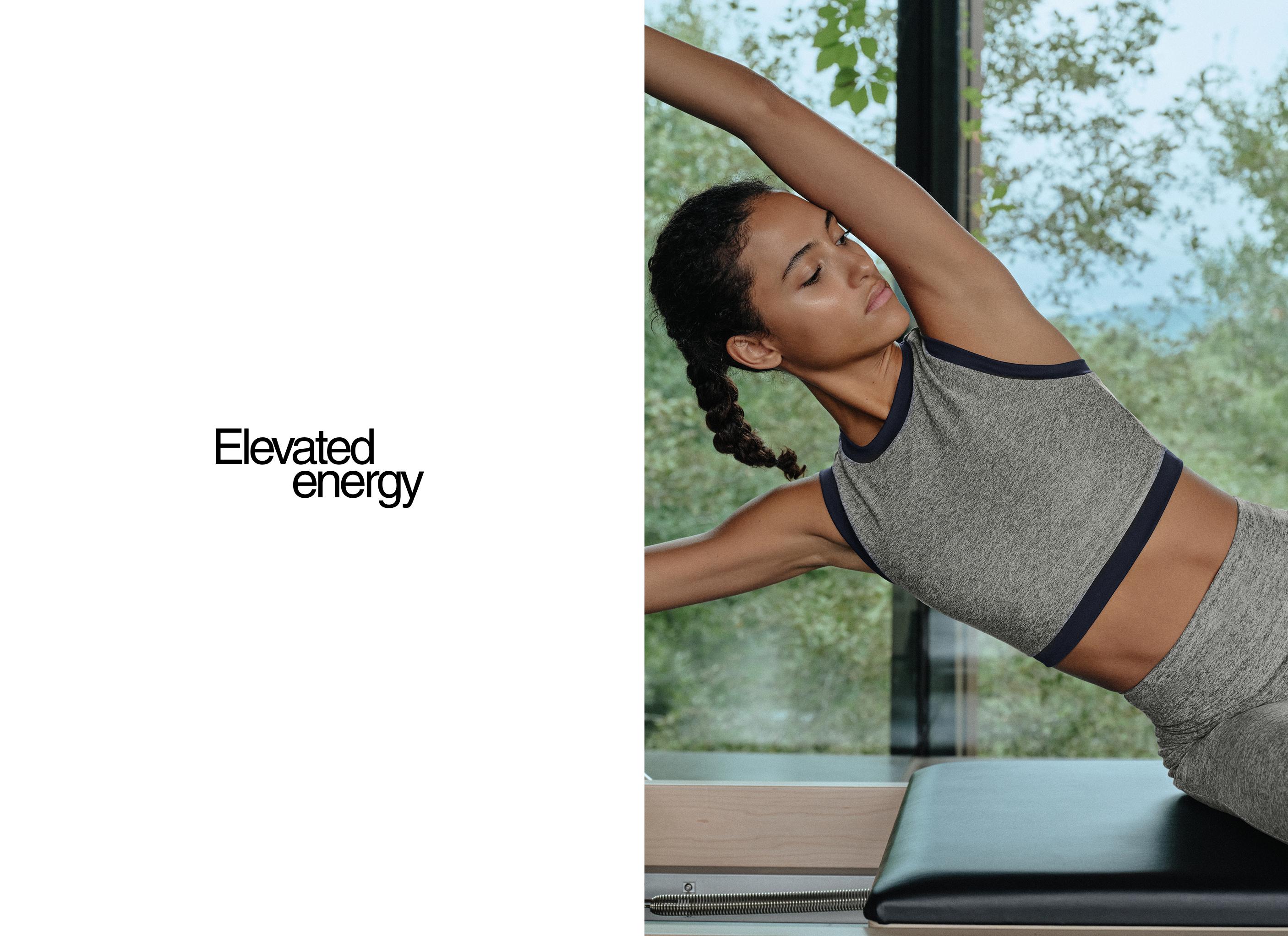 Heather gray sports bra set with a crew neck, sleeveless design, and contrasting trim, with matching leggings.