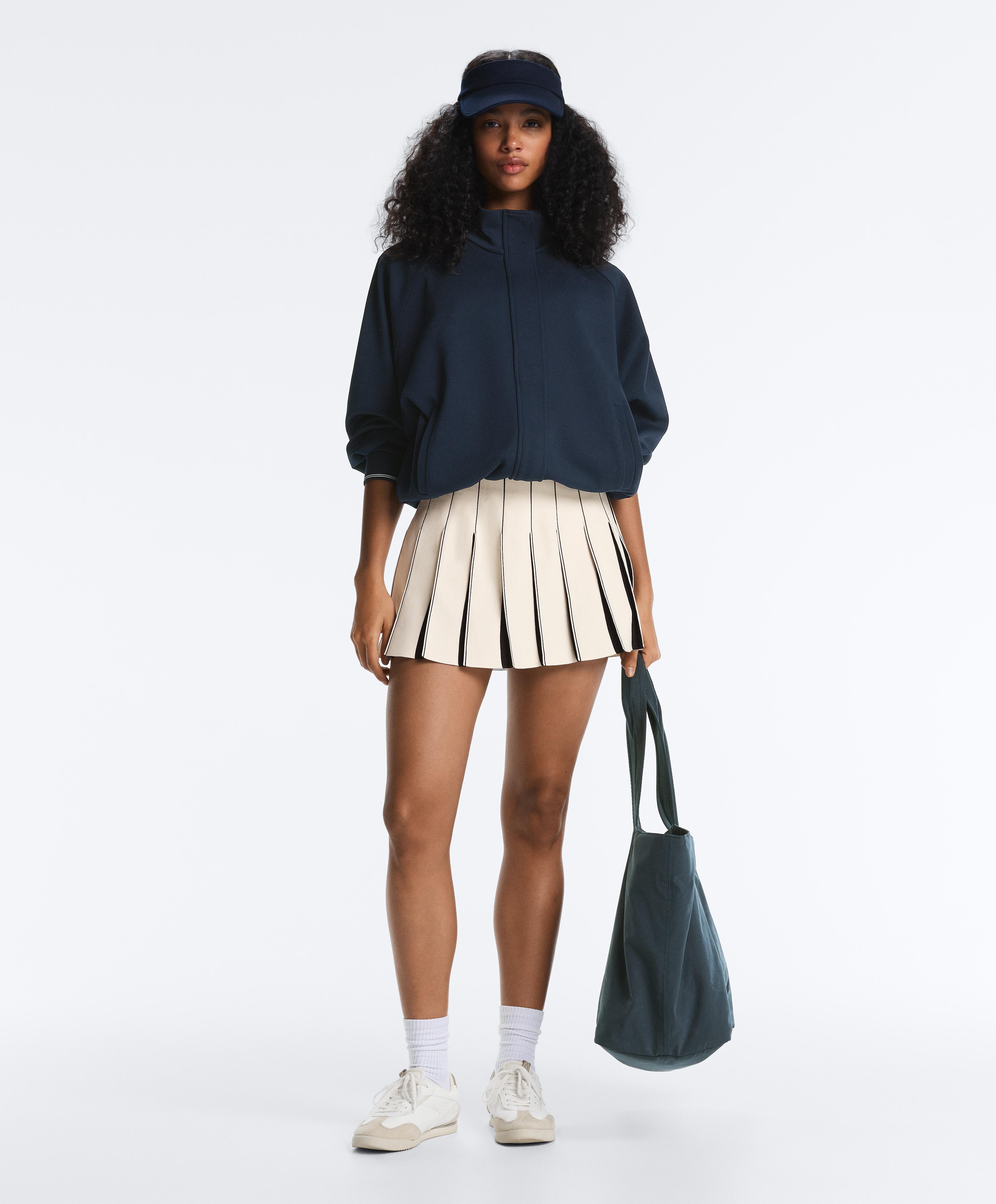 Short high rise seamless pleated skirt — PALE ECRU
