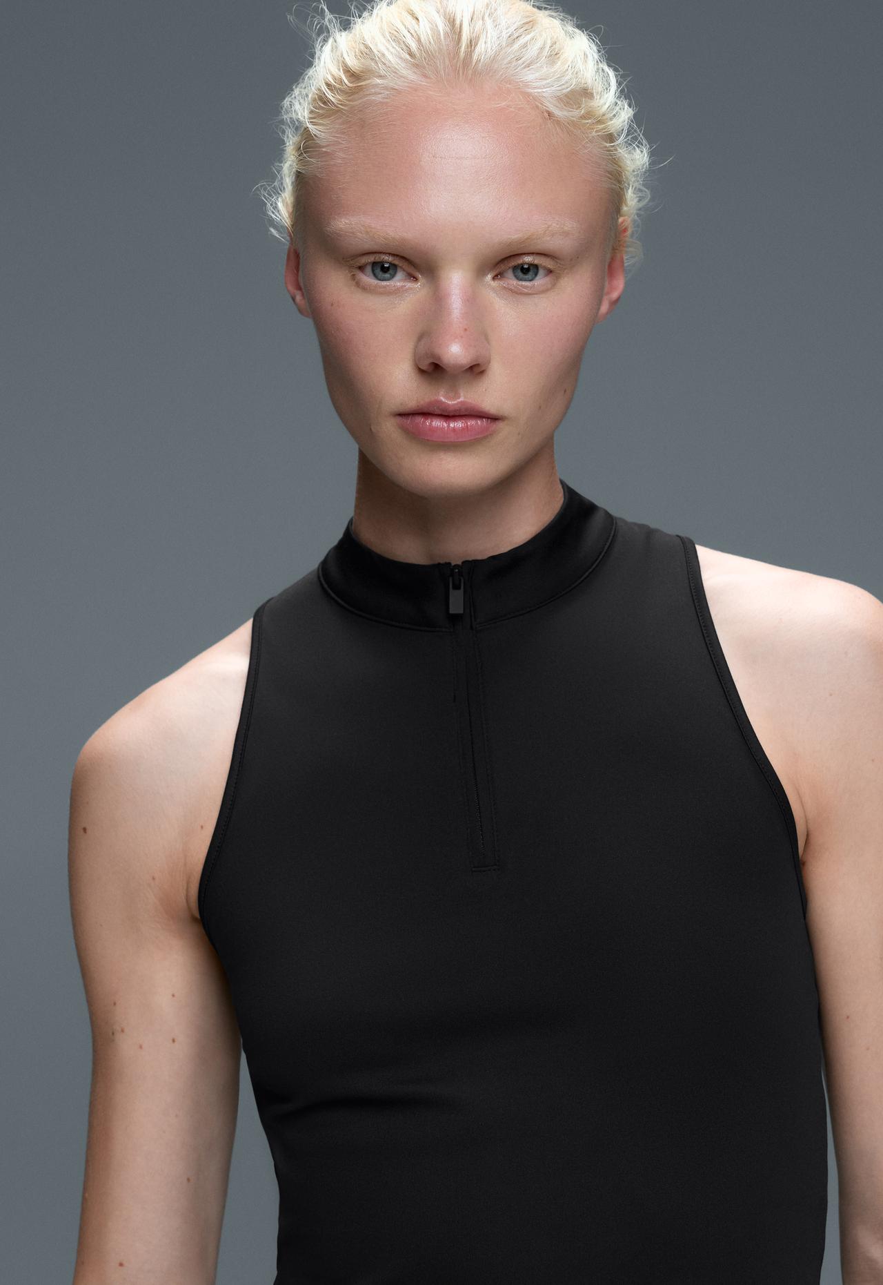 Half-zip sleeveless top — BLACK
