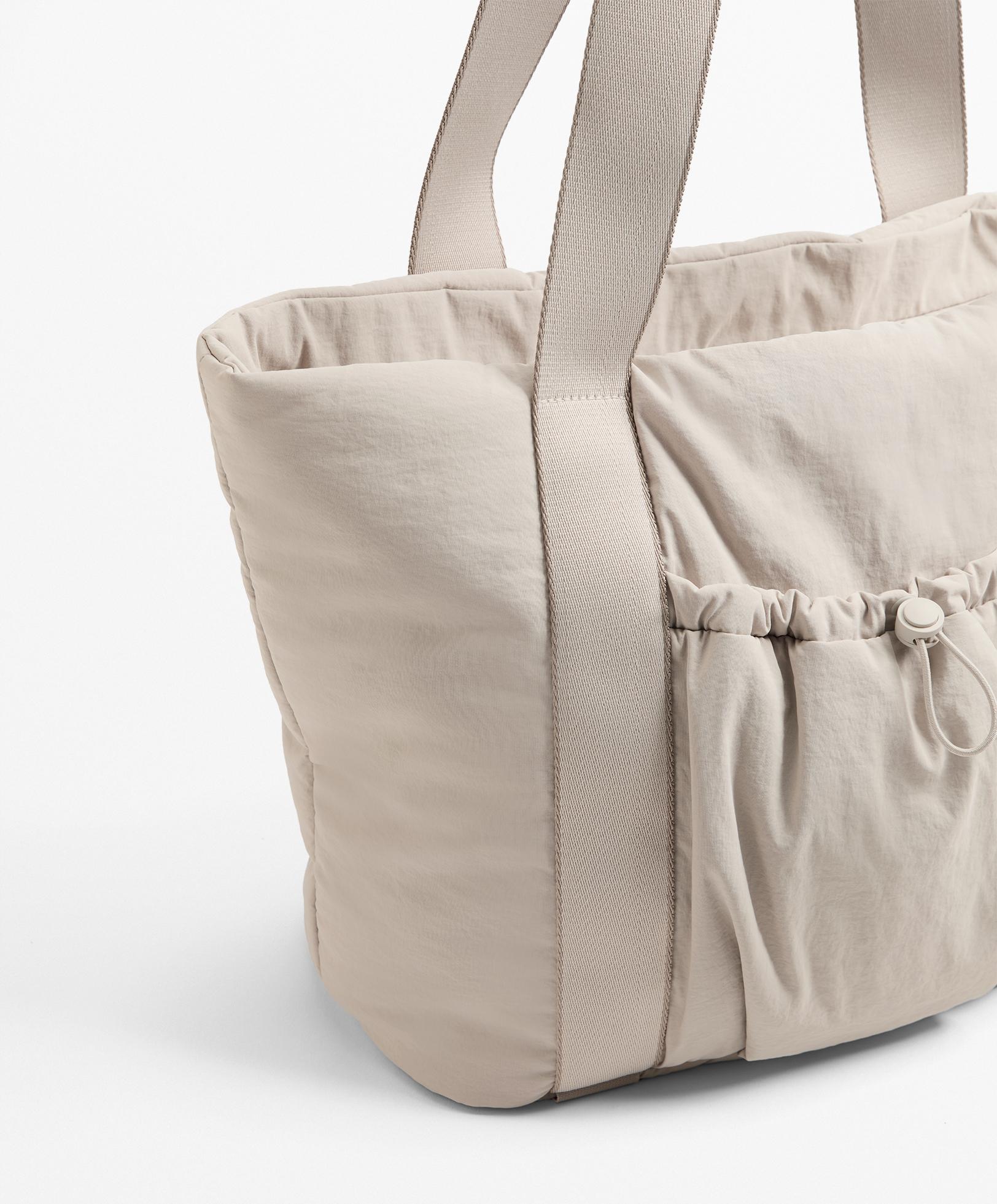 Mala shopper com bolso à frente