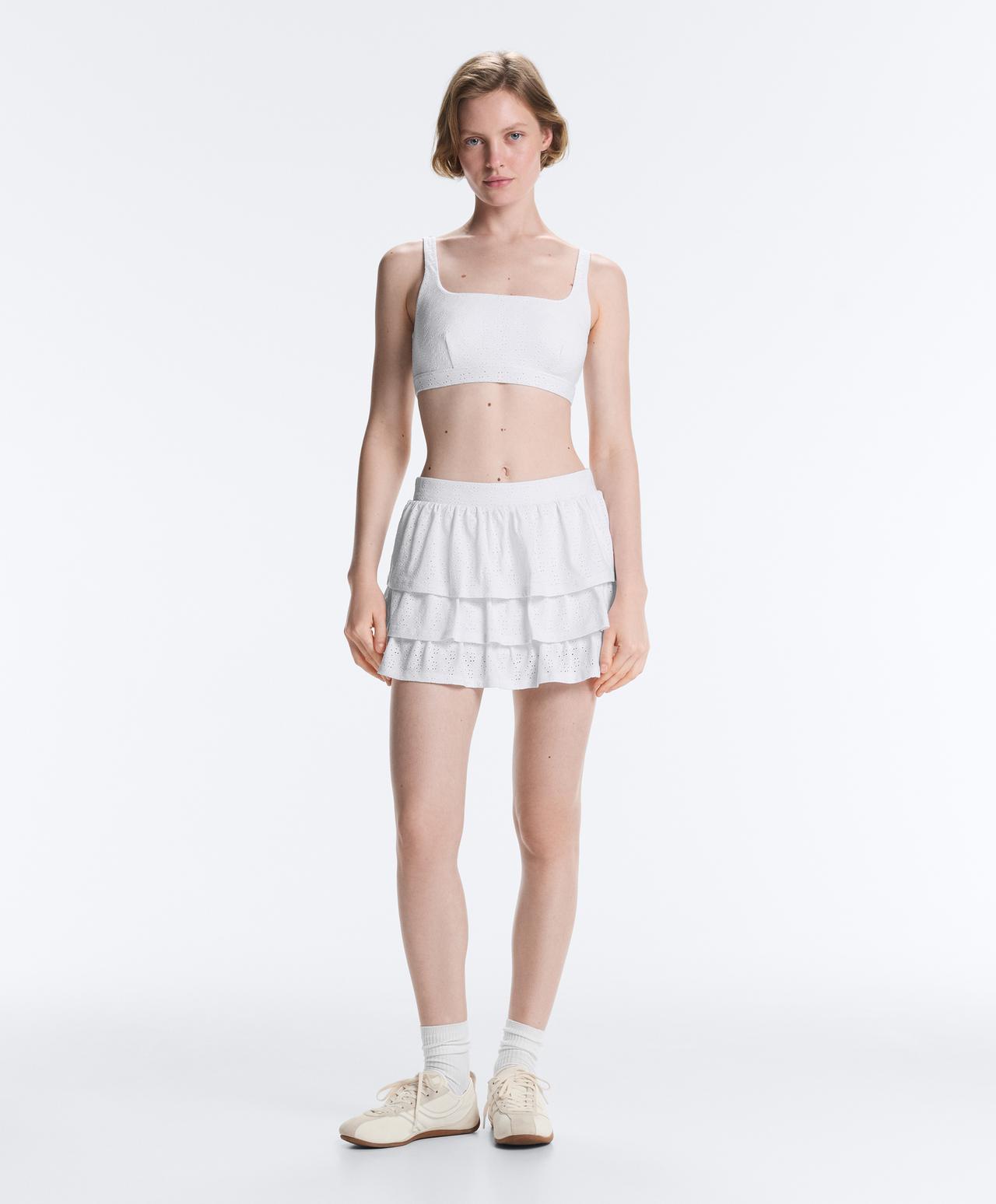 Embroidered medium-support sports bra — WHITE