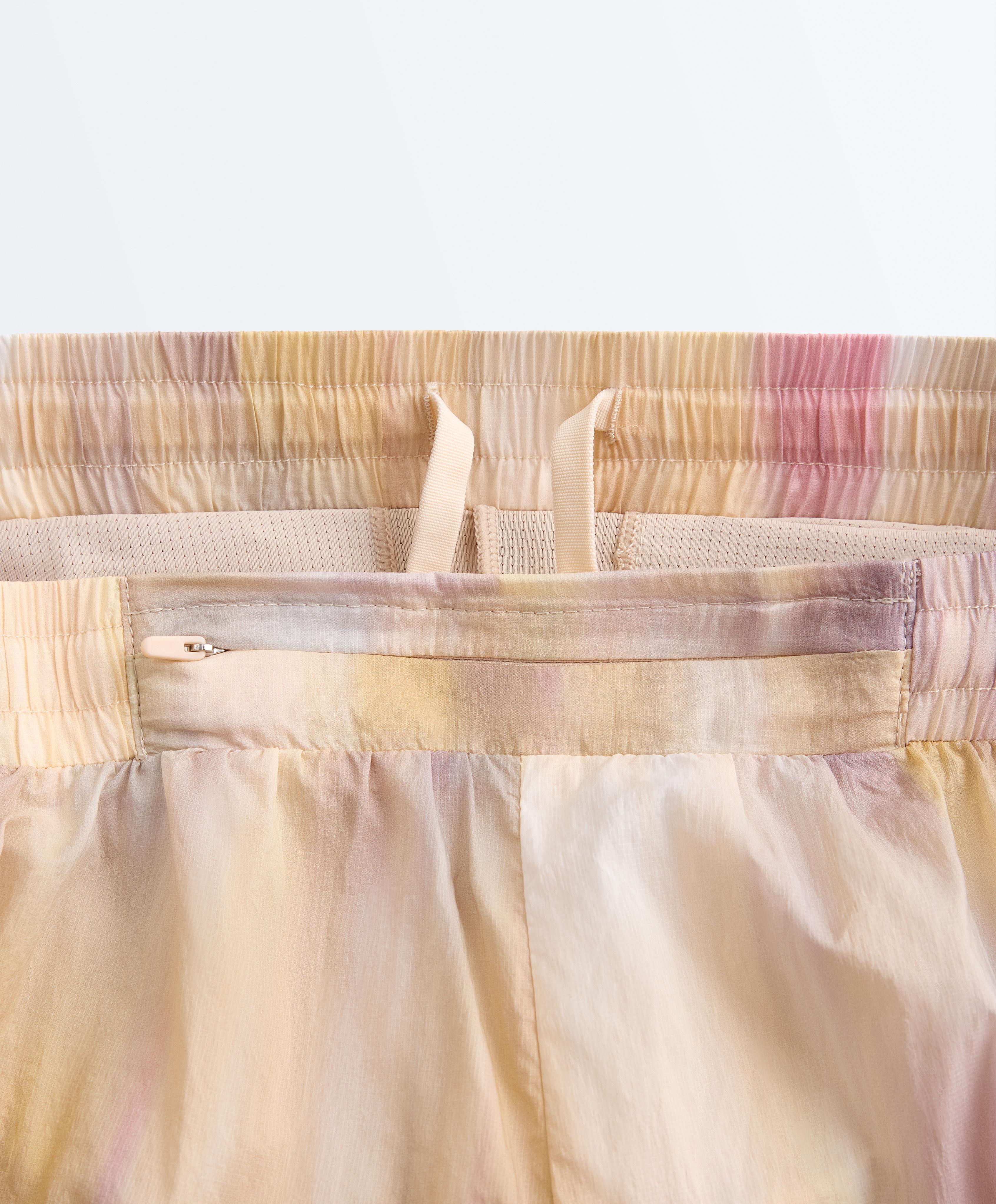 2-in-1 tie-dye mid rise technical shorts — VANILLA