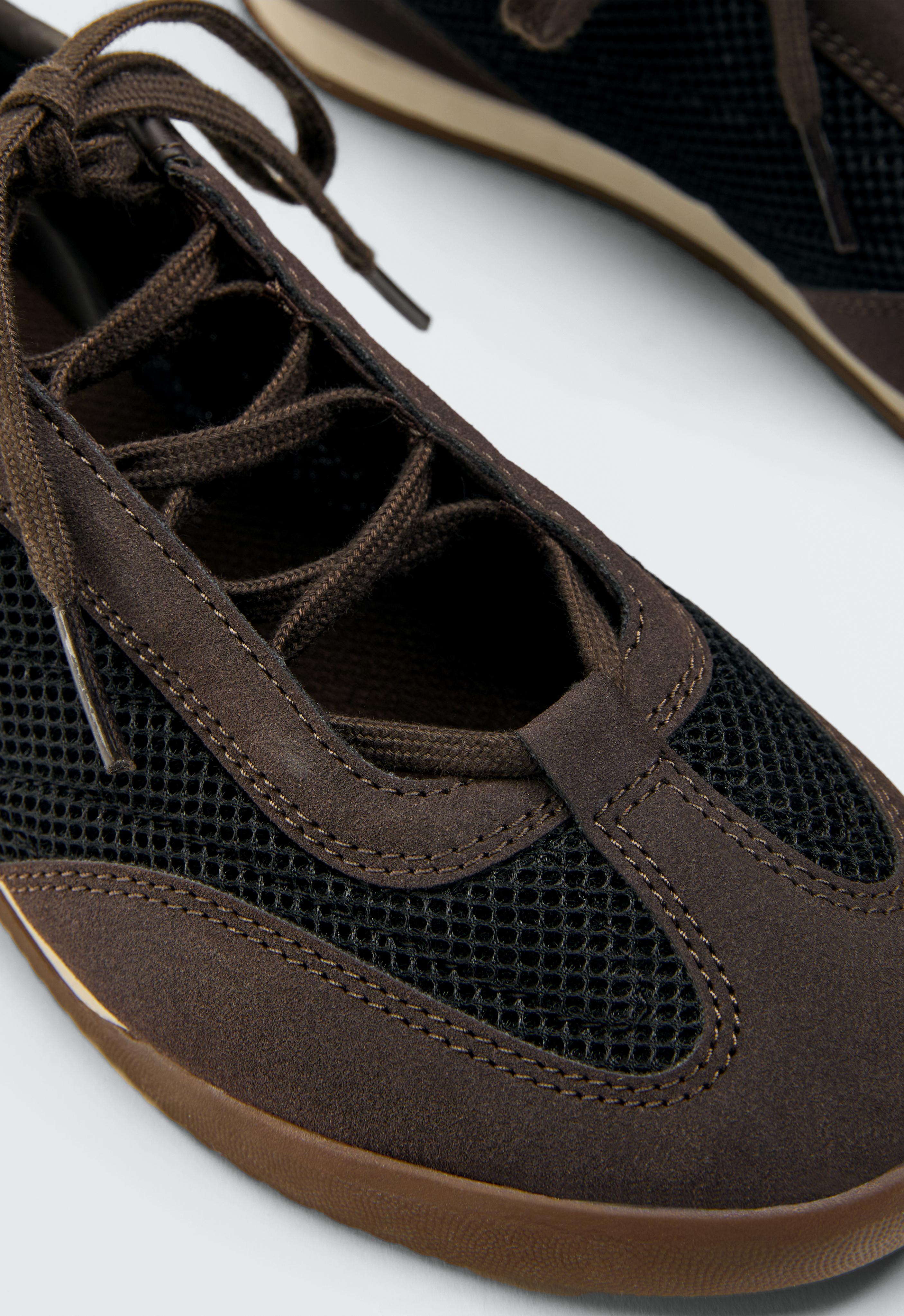 Mixed-material mesh trainers