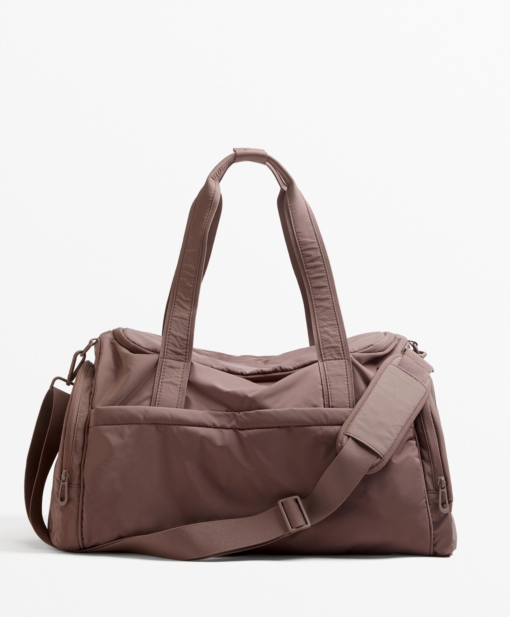 Technical bag with side pockets