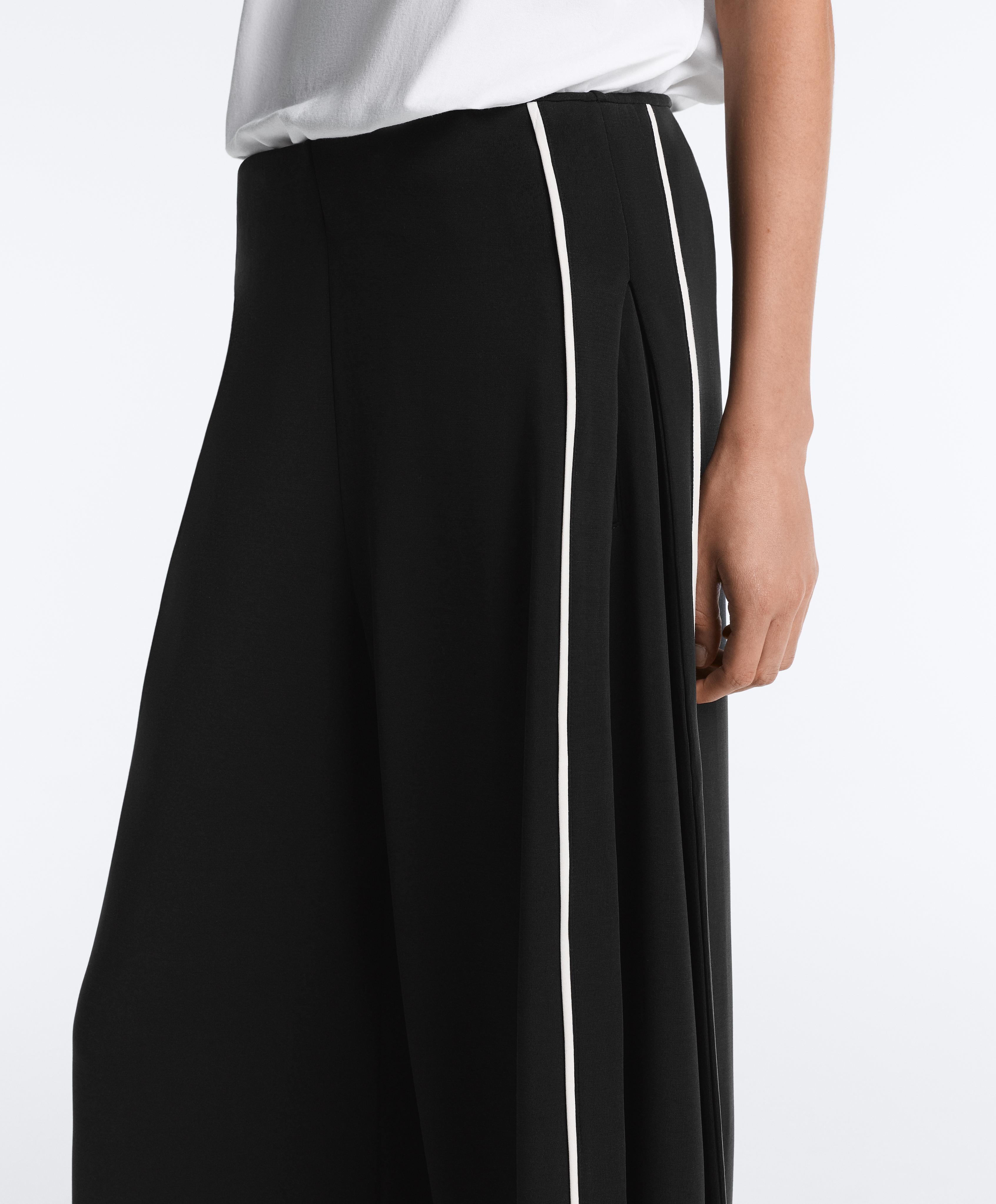Soft-touch modal wide-leg trousers with contrast piping — BLACK