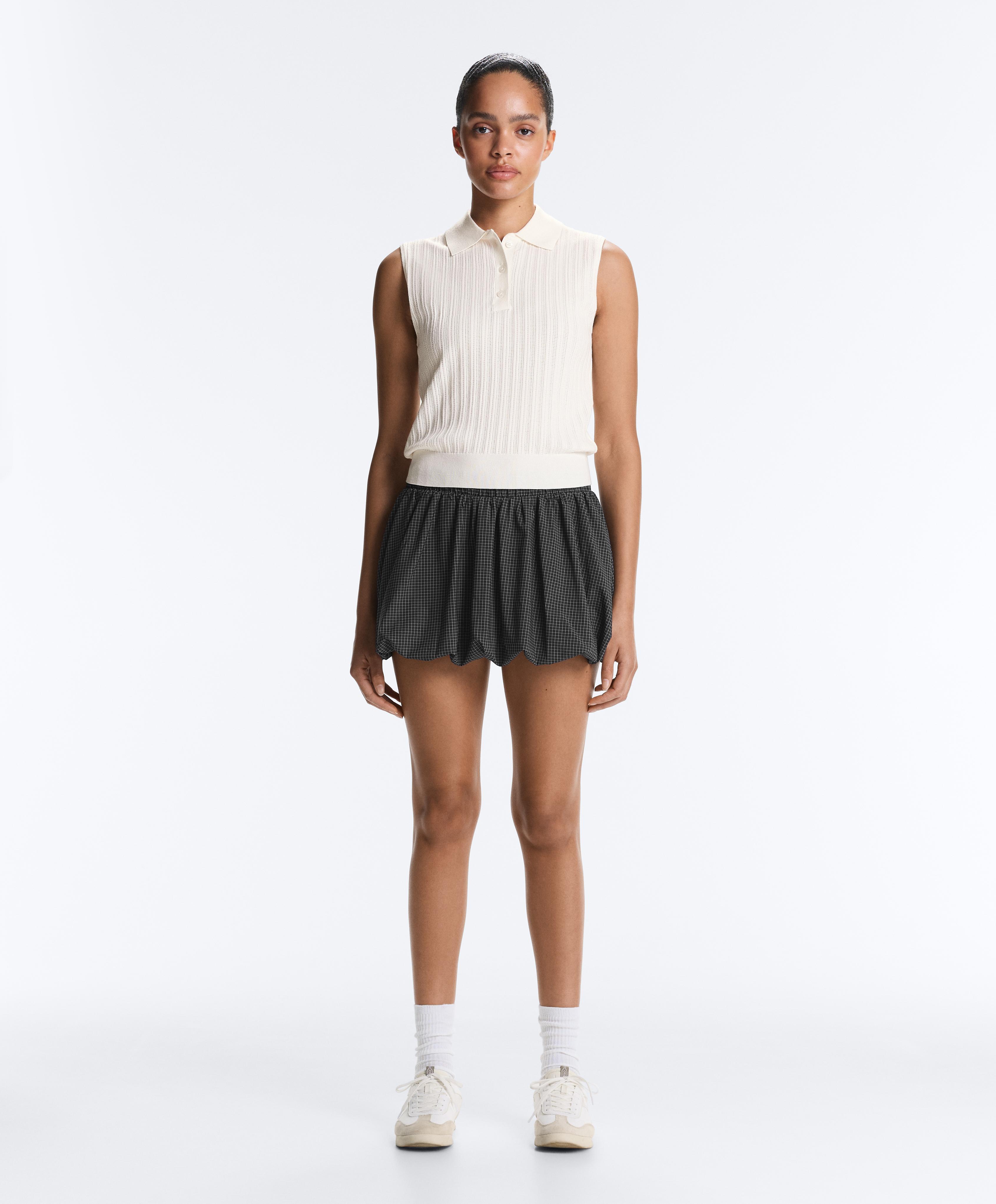 Sleeveless open knit jumper