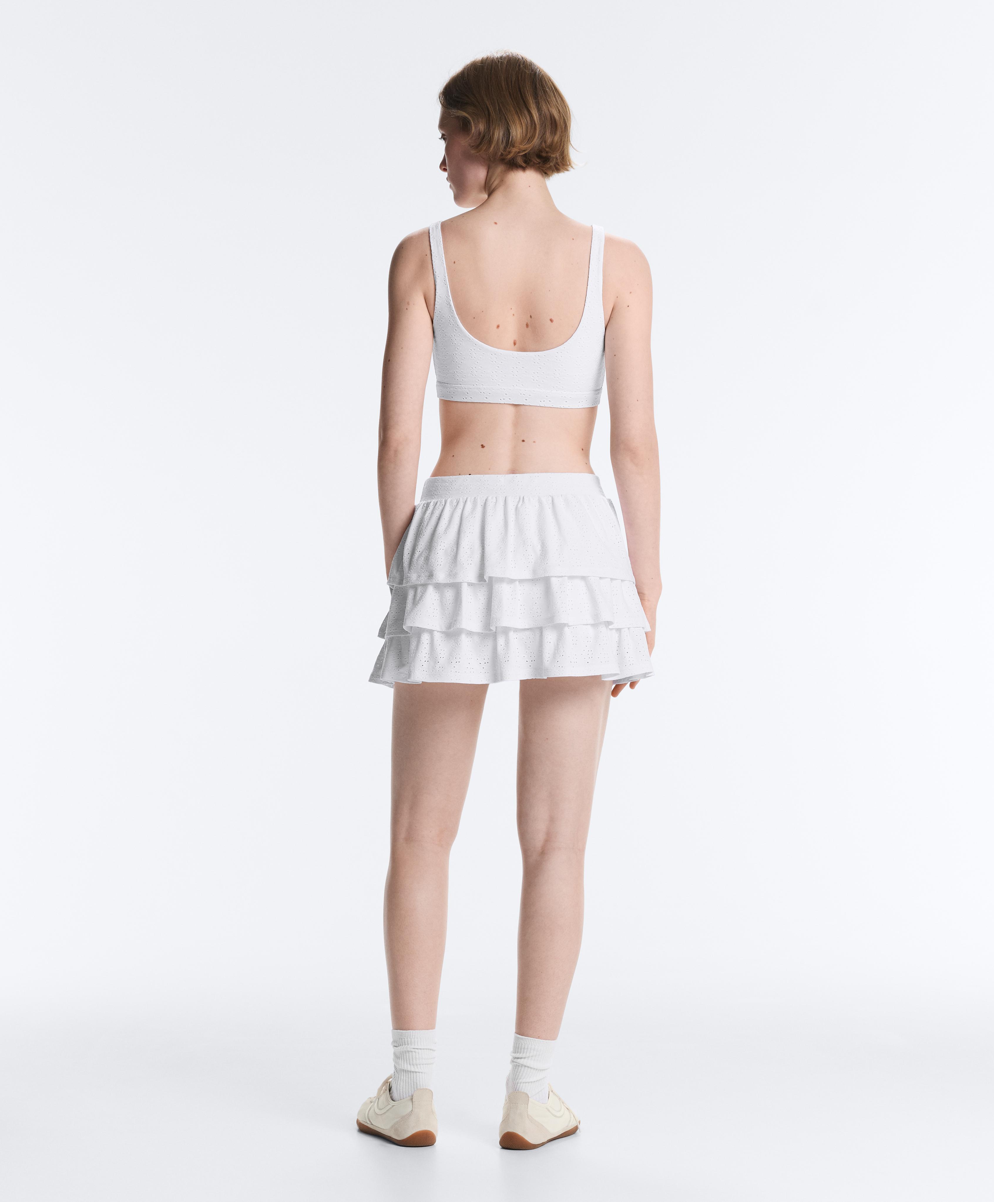 Embroidered medium-support sports bra — WHITE