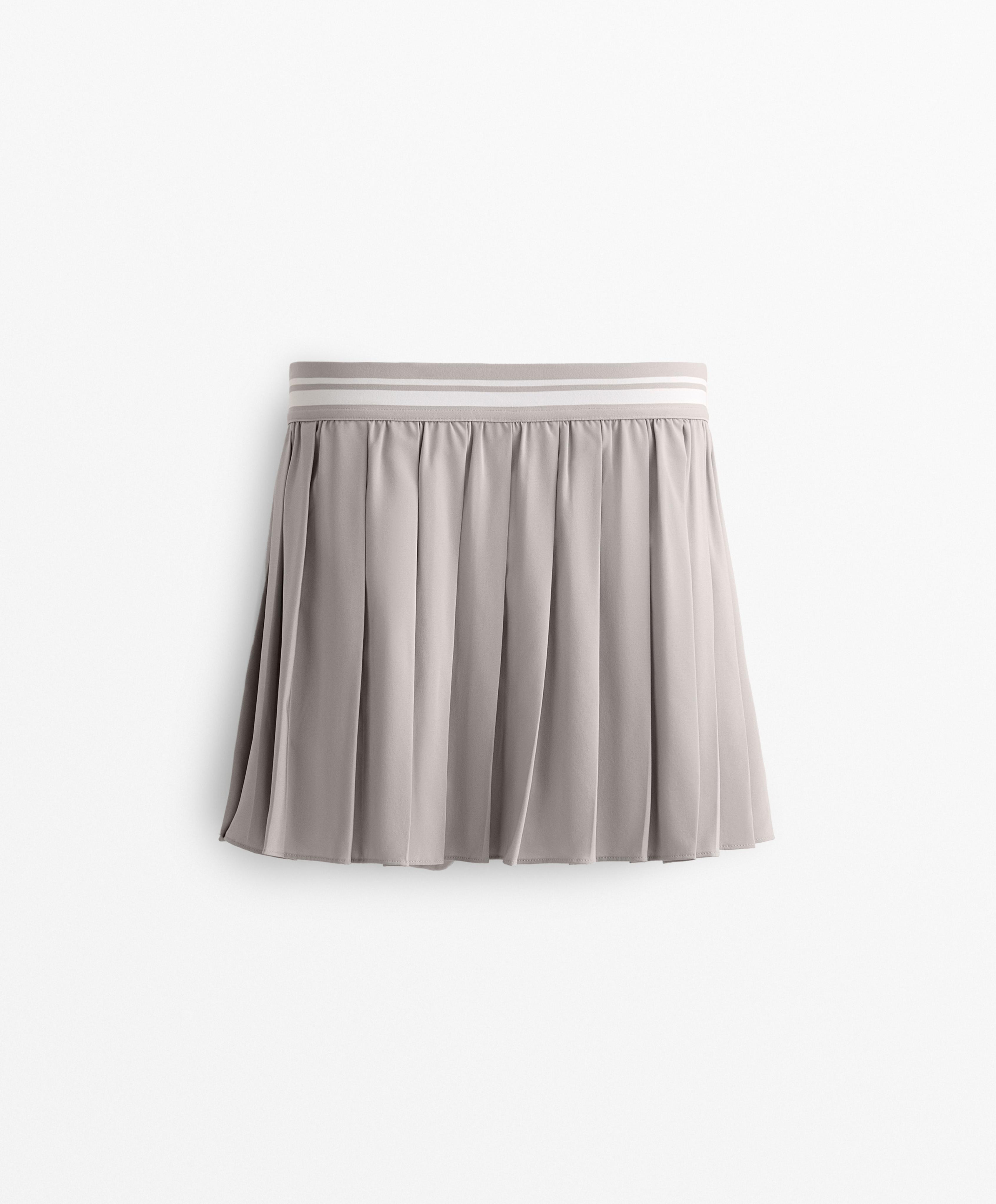 Pleated compressive skirt