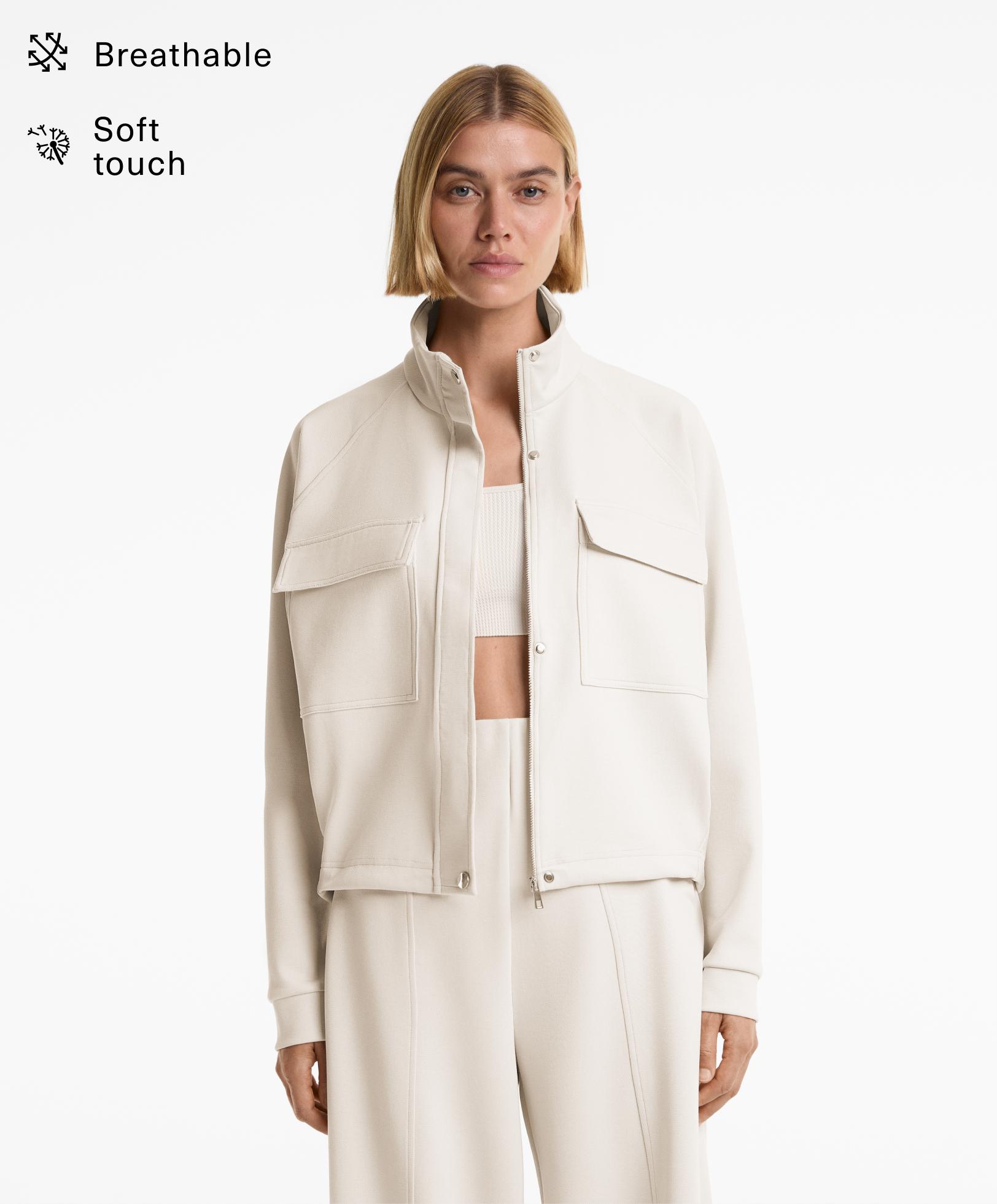 Veste en piqué à poches contenant du coton