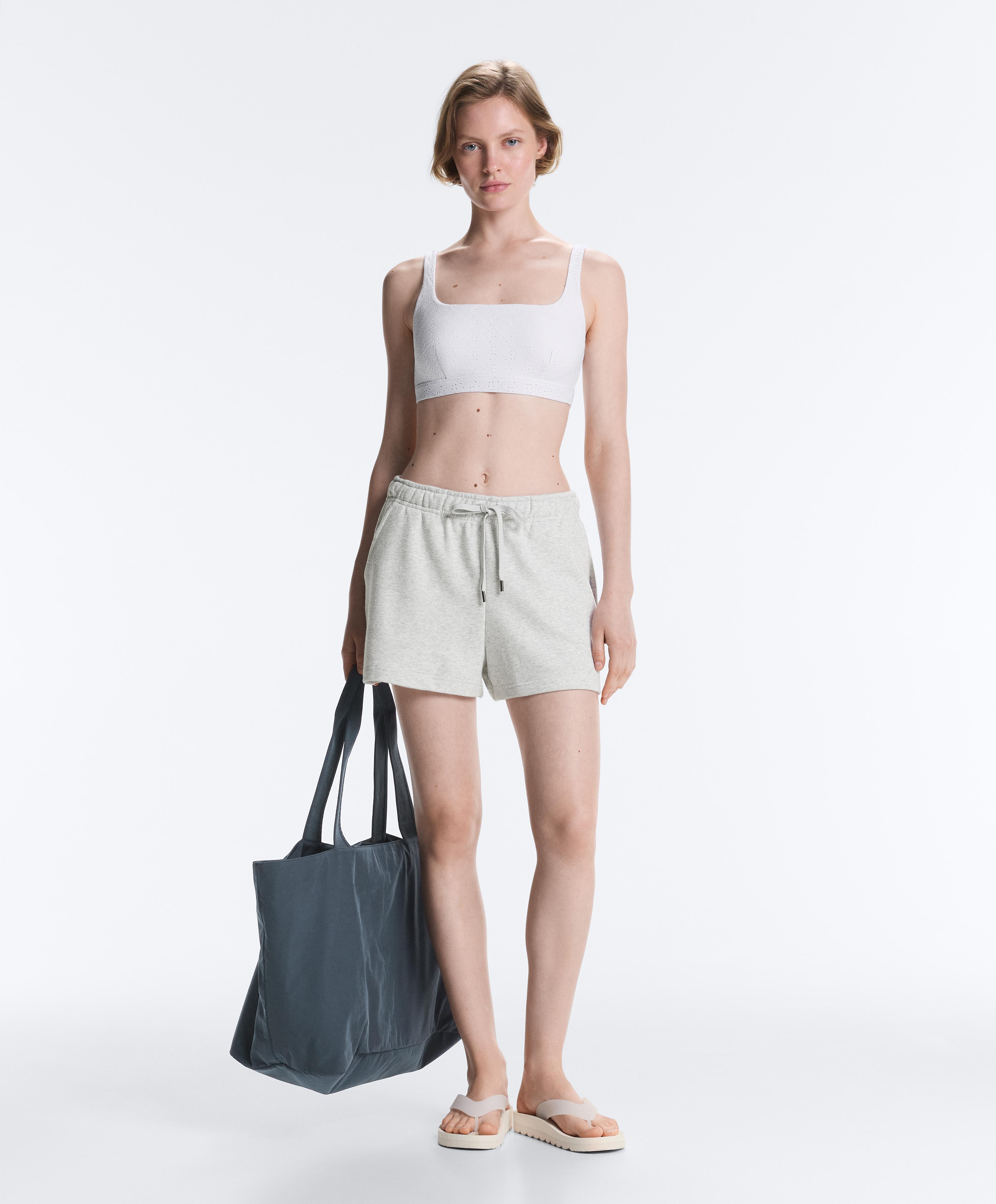 Embroidered medium-support sports bra — WHITE
